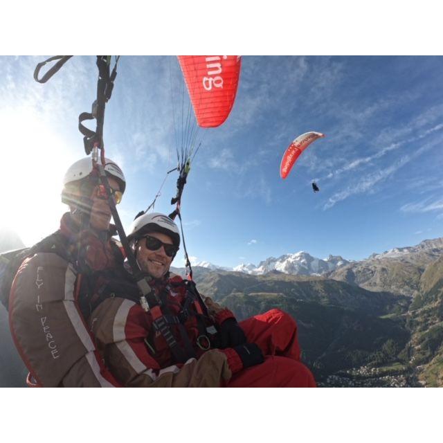 This is us paragliding in Zermatt near the Matterhorn, with Grace visible in the background.