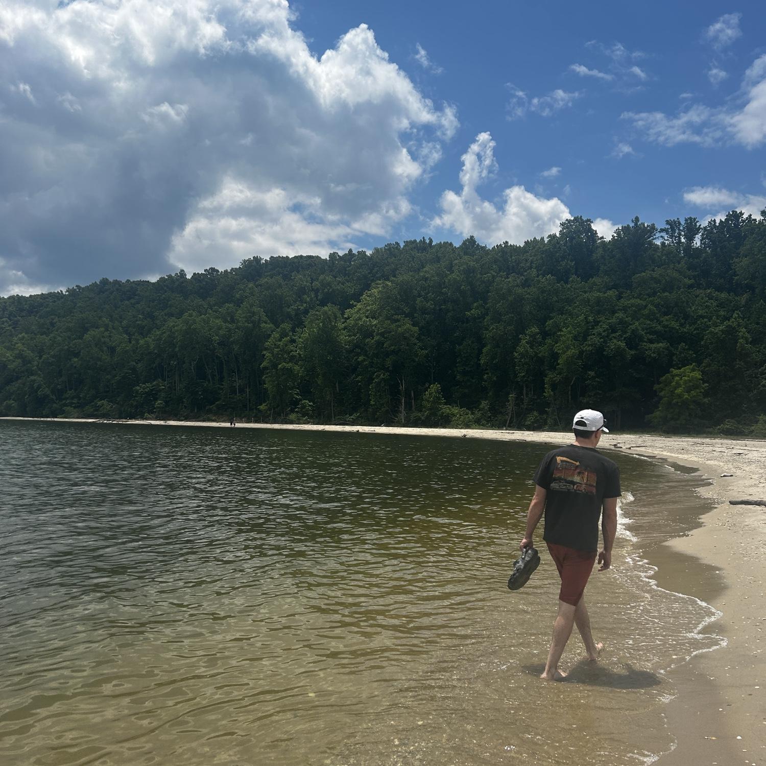 Mark and Maddi looking for shark teeth while visiting Maryland family