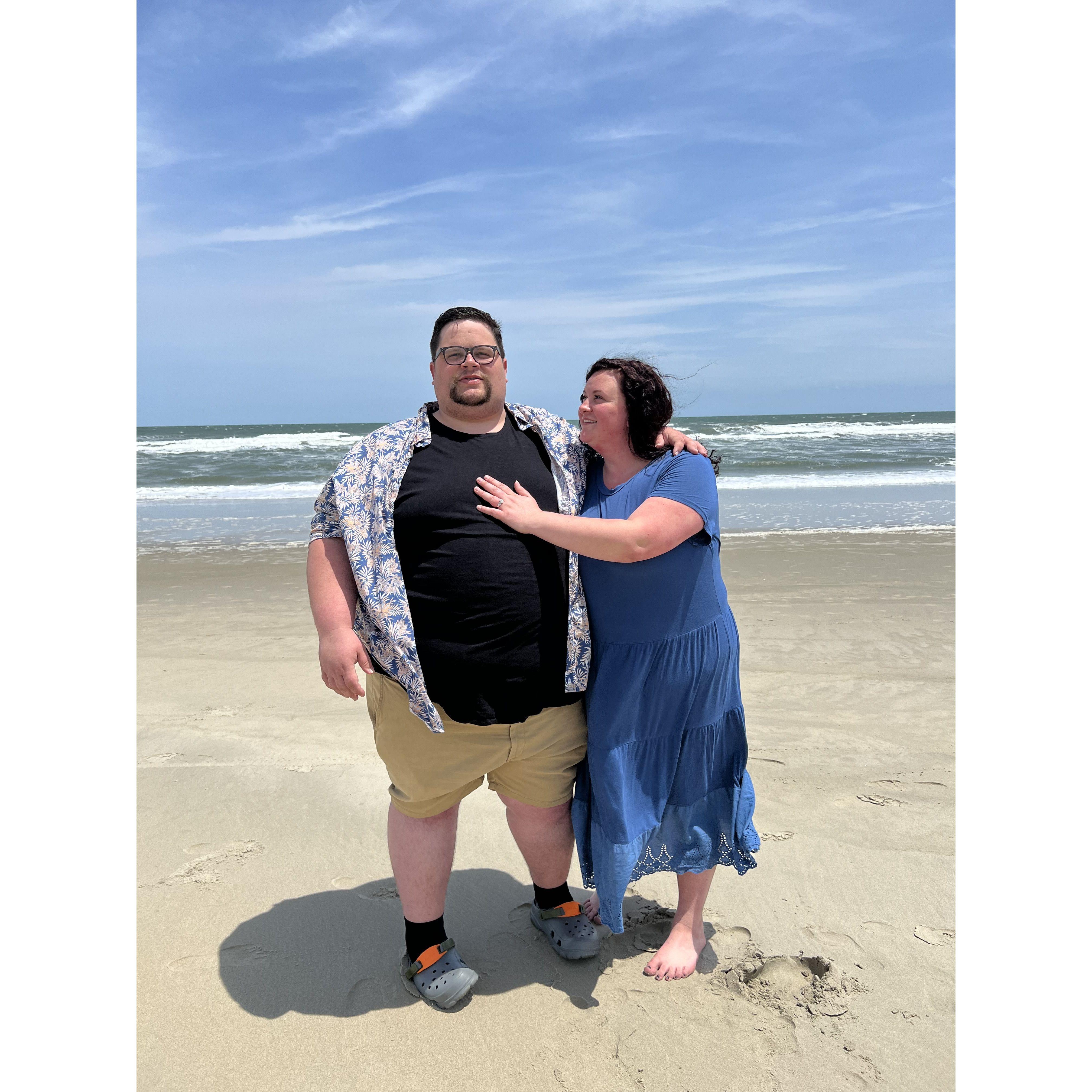 photos of the us on the beach after getting engaged
