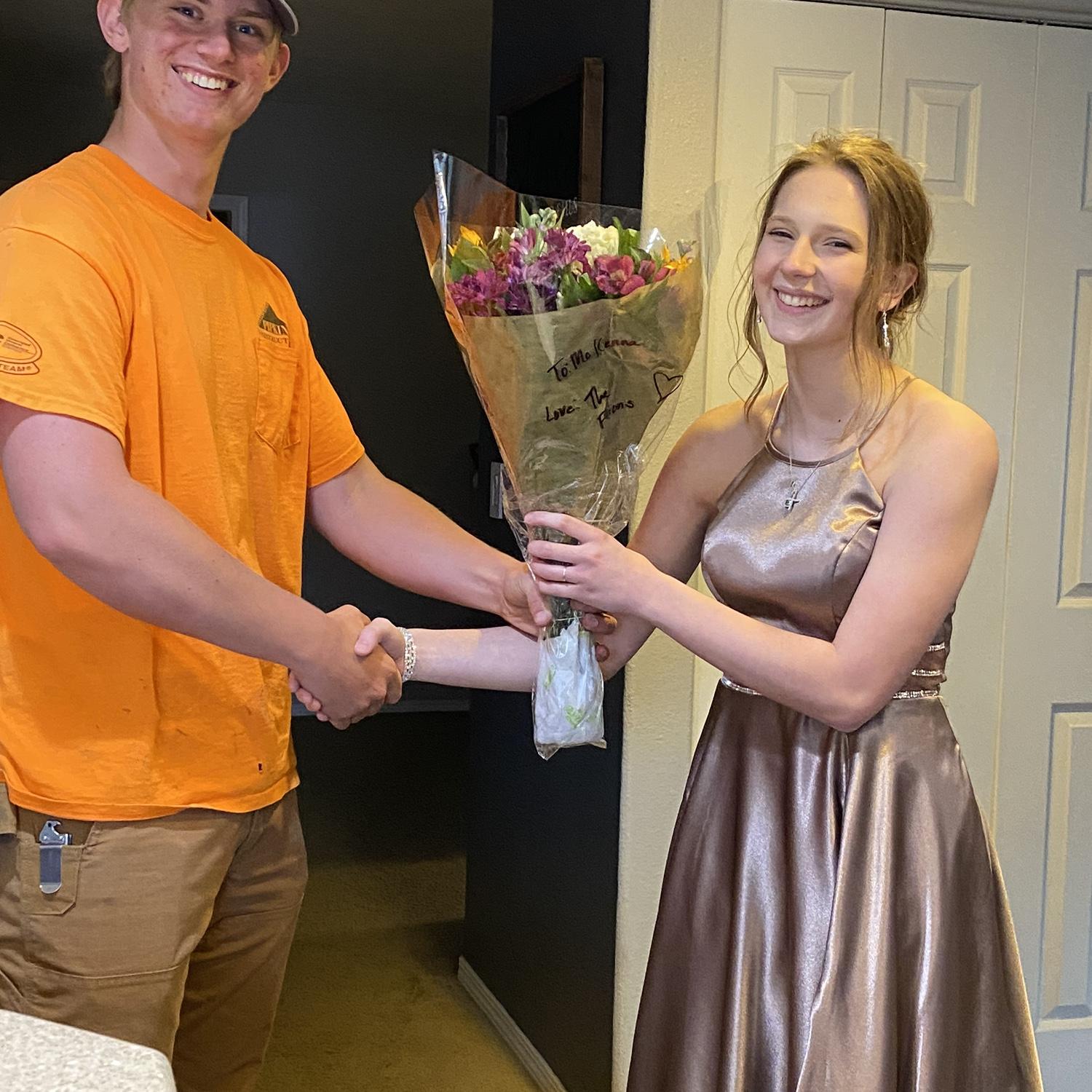 After the homecoming parade John and his family brought me flowers as I was nominated homecoming princess.