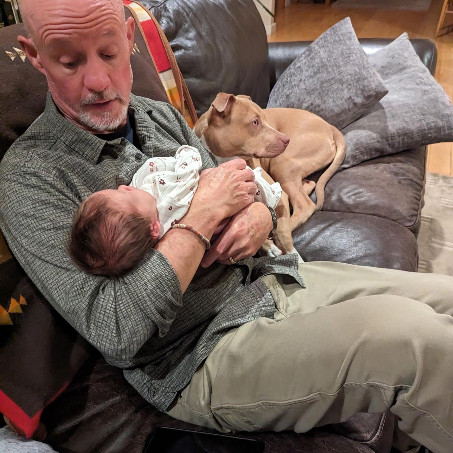 Tim's dad, Jeff, with baby Olive