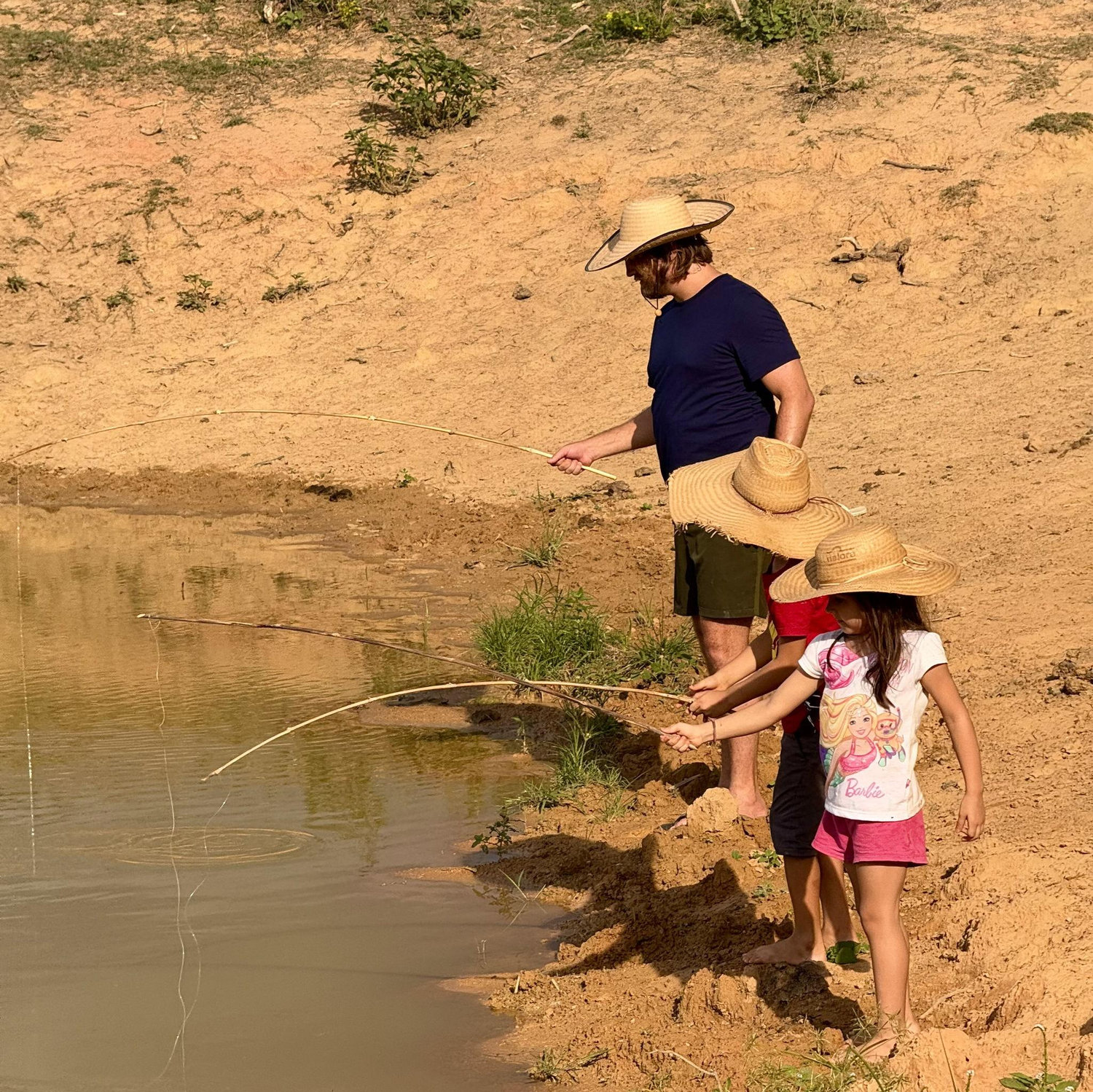 Brennan fishing with his nieces & nephews at the farm in Brazil.