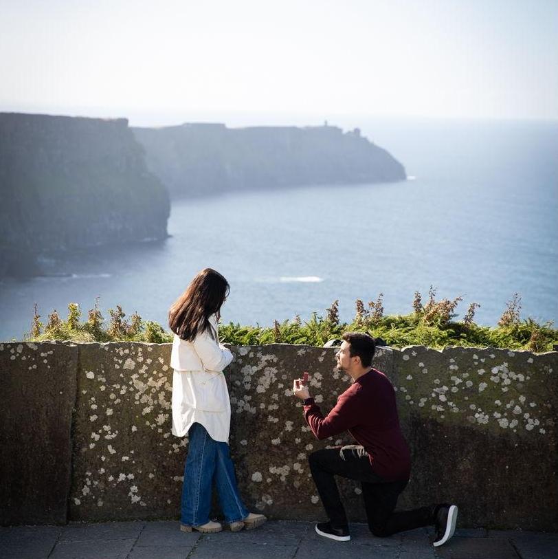 Brady proposing to Victoria at the Cliffs of Moher in County Clare, Ireland on 10/01/2024