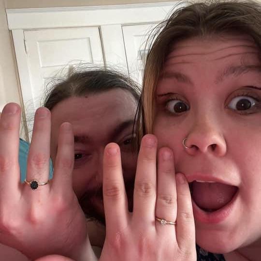 Showing off our rings after we got engaged