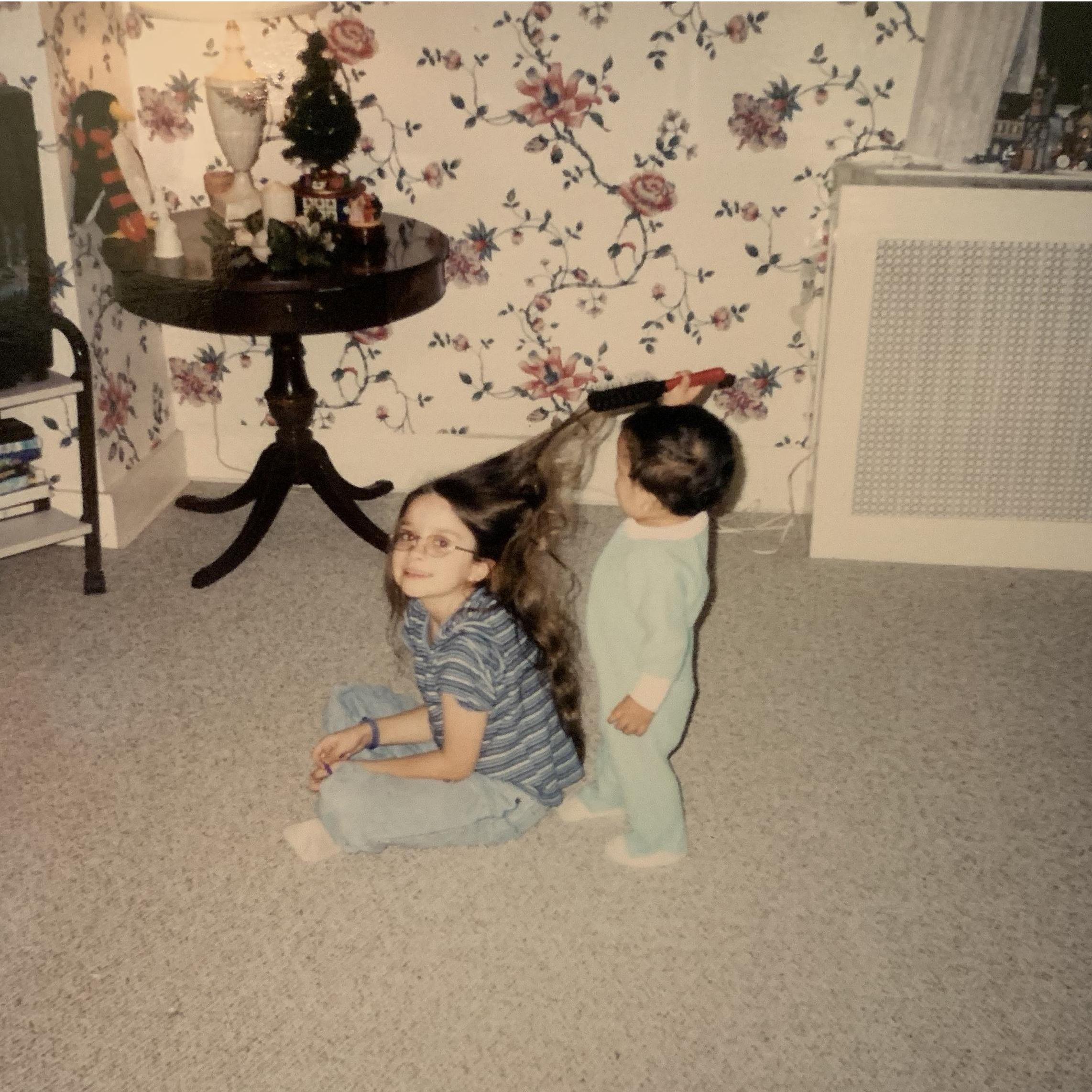 Alexis getting some hair help from her brother, Nicolas (2001)