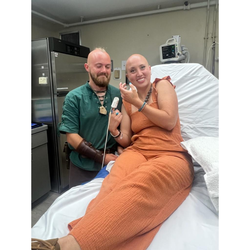 She said yes! And then went straight to the ER... darn engagement sword.