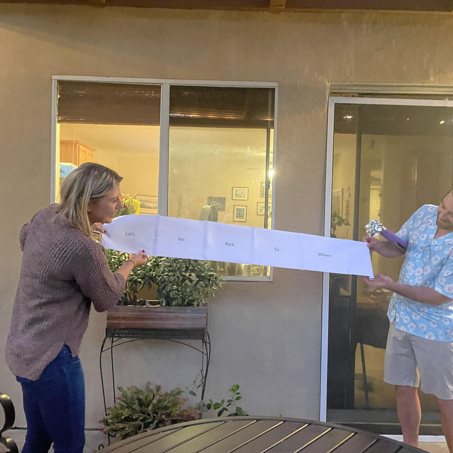 The scroll read: "Let's go back to where it all began" with a picture of the Stagecoach logo. Betsy is still trying to convince Taylor that we have to go back every year for the rest of our lives.