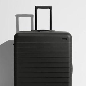 Shop Large & Checked Suitcases in Jet Black | Away