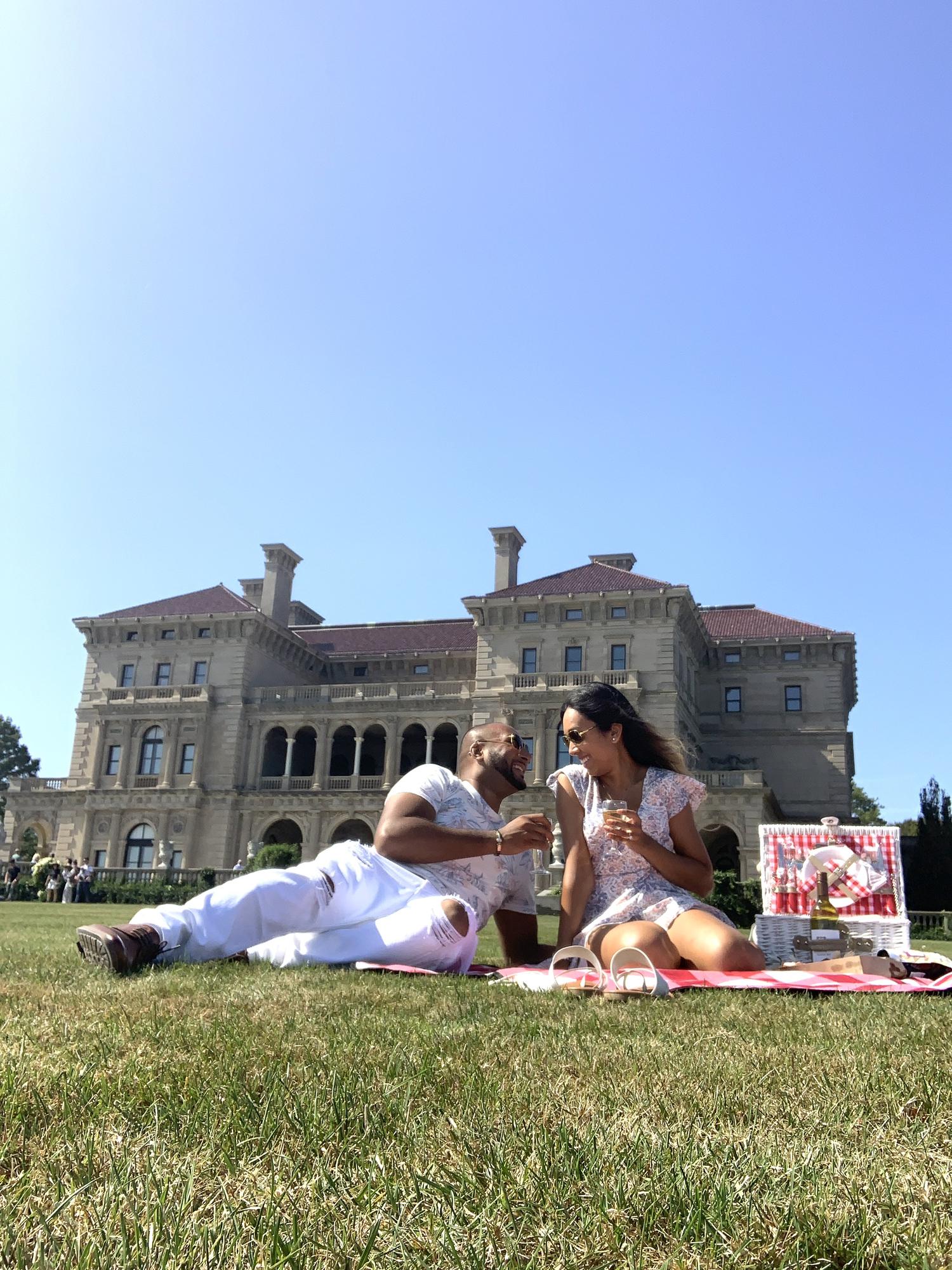 Enjoying a romantic picnic in front of the beautiful Breakers mansion.