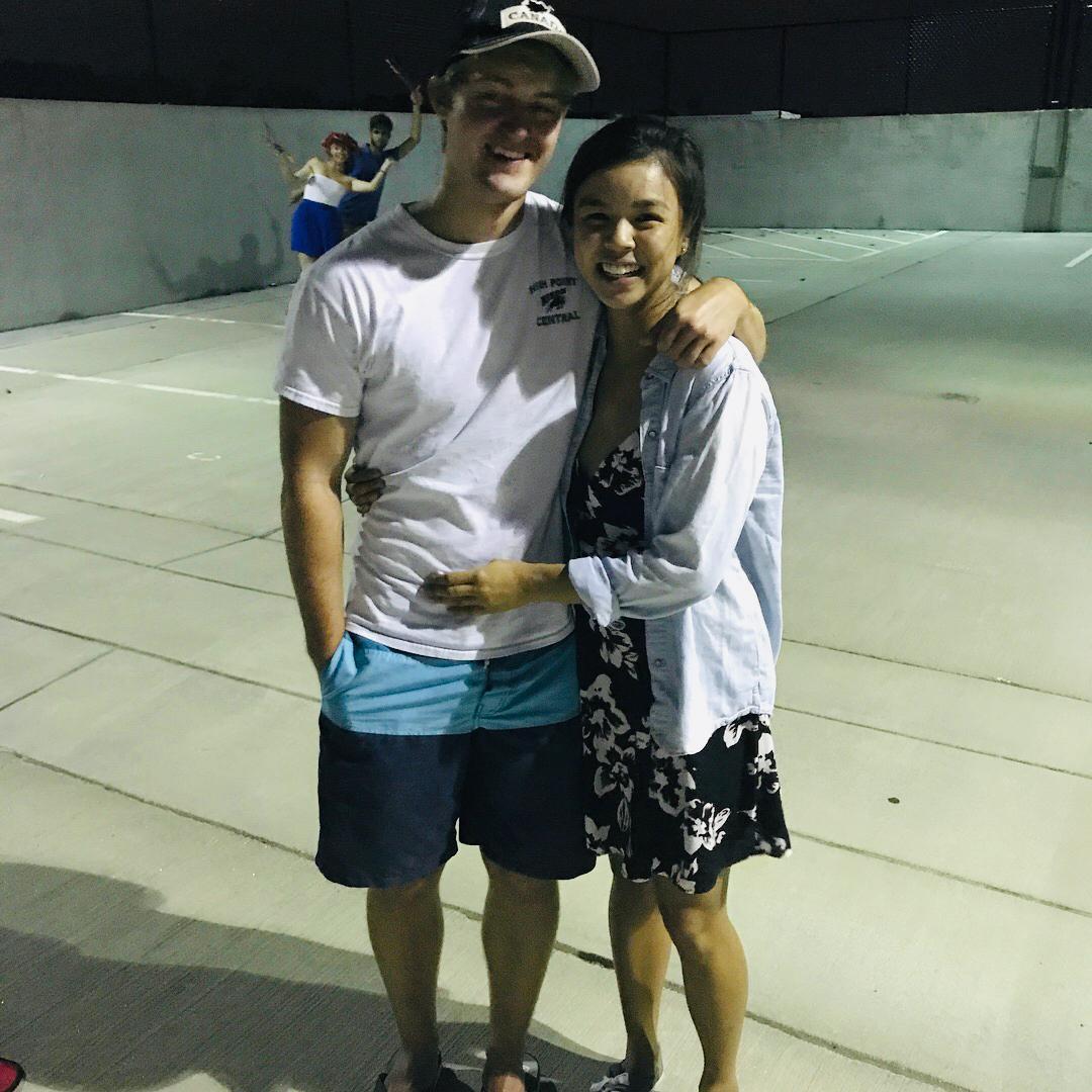 Our first photo together as a couple...with friends Allie and Doug in the background! July, 2017