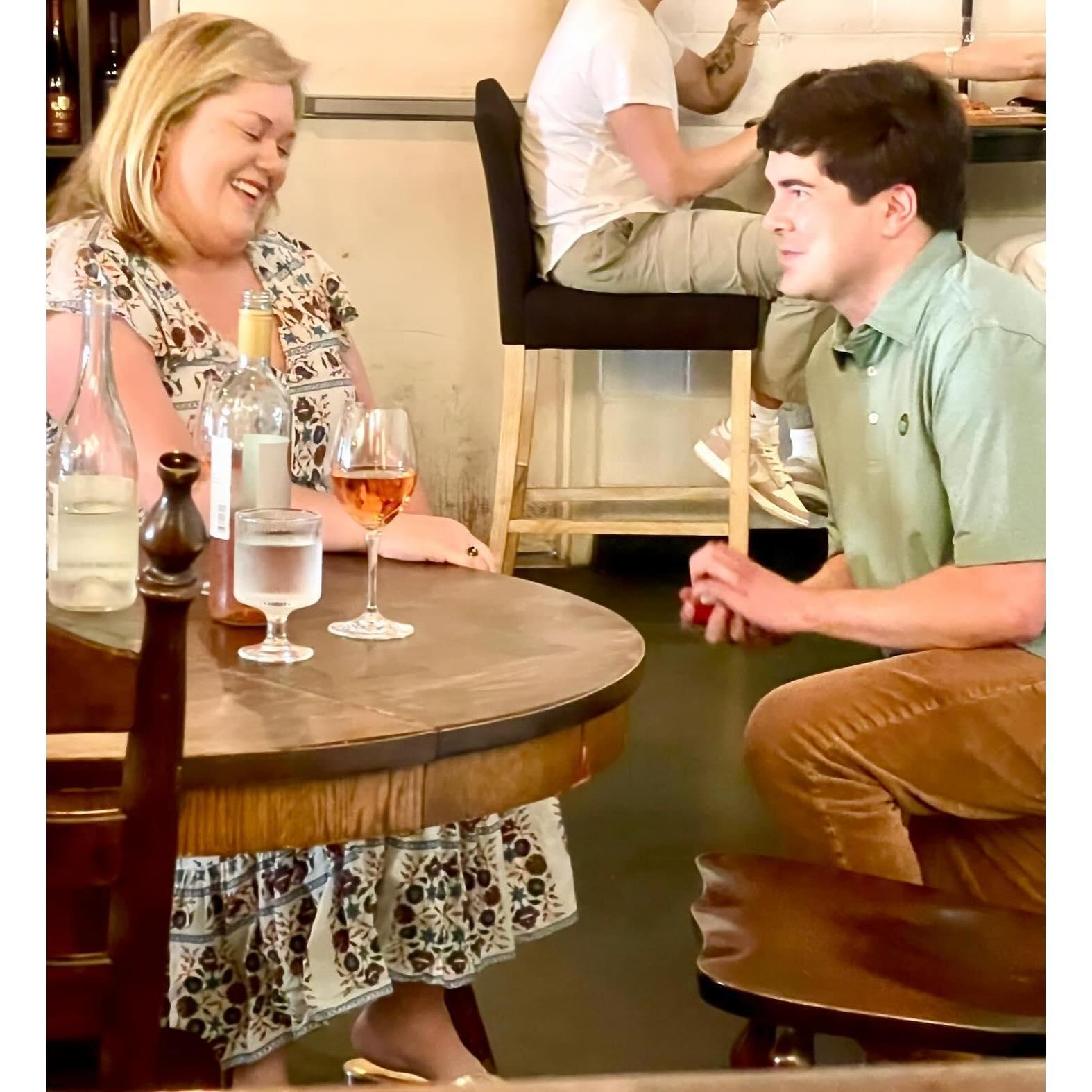 Our engagement at Bohemian Wine Bar in Plaza Midwood. The location of our first date!