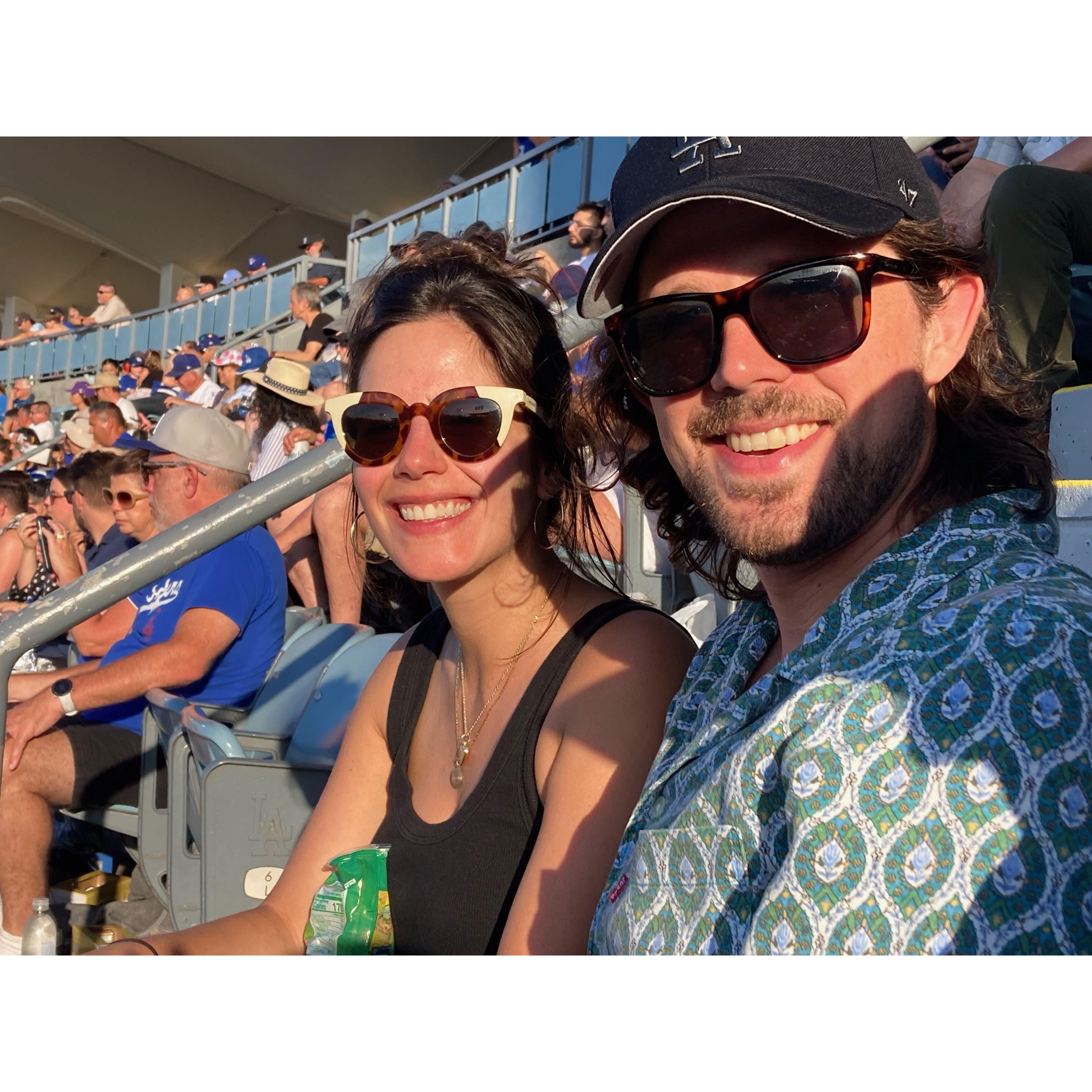 Bella being a good sport and temporarily supporting the true greatest team in baseball at Dodger Stadium