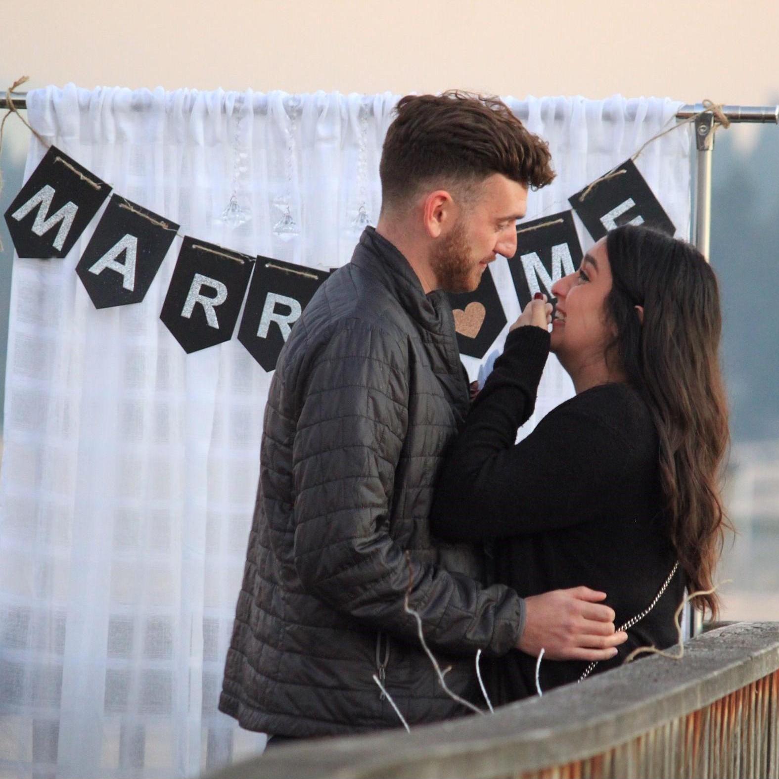 Our proposal was the biggest surprise of my entire life (I think you can tell by my facial expression just how freaking happy I was). This was taken right after I saw our family/friends on the dock.