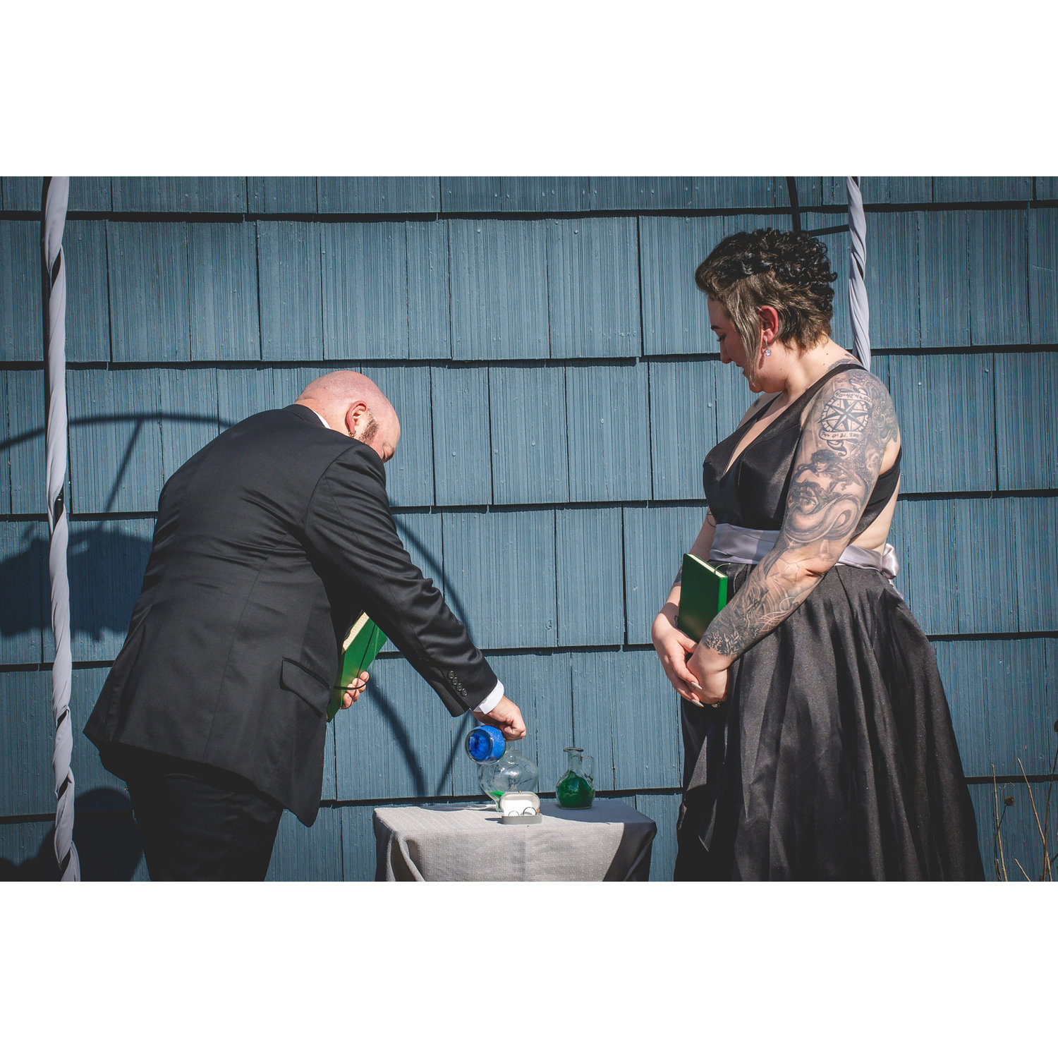 The couple made promises to one another, pouring a layer of sand with each statement.