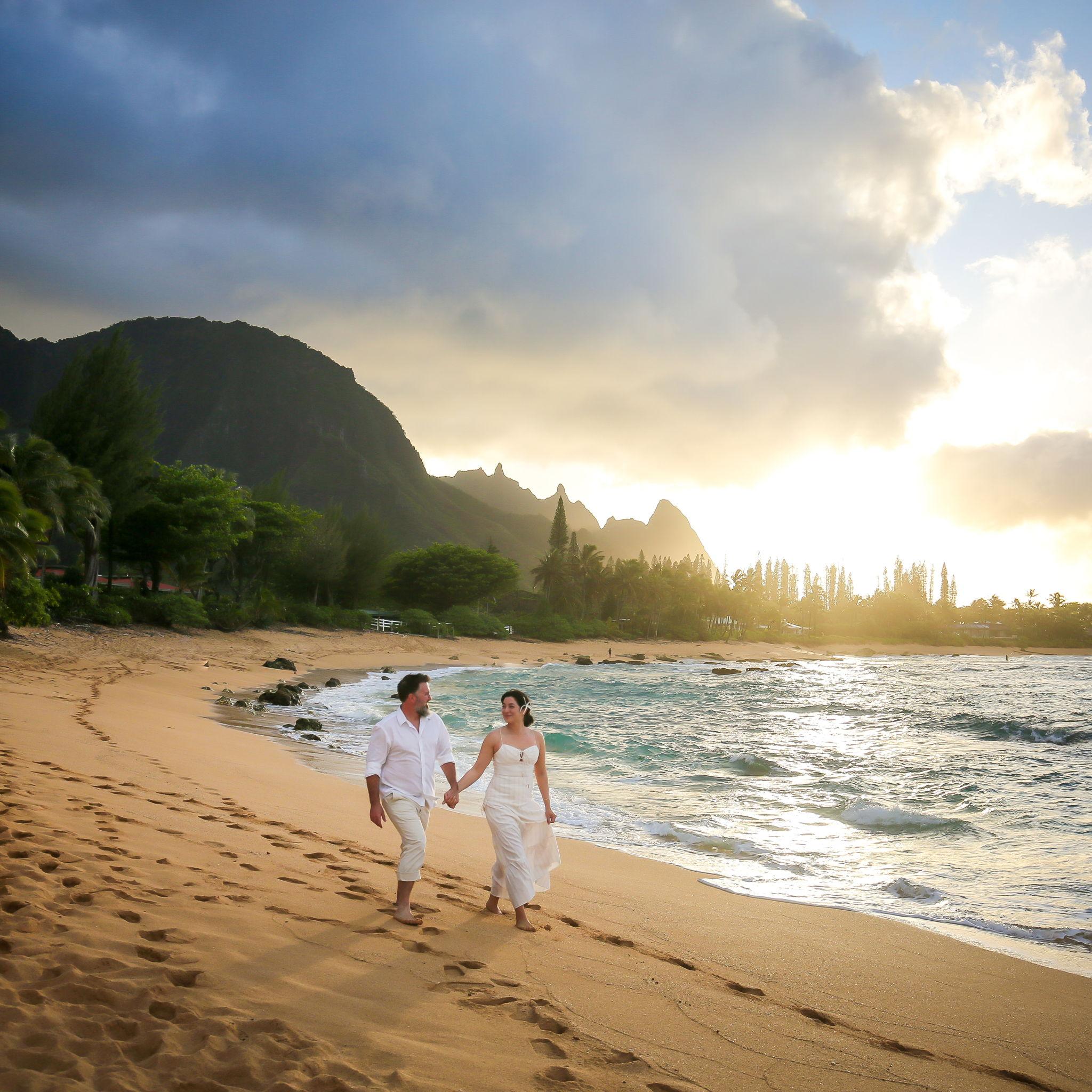Happily walking along the beach, post proposal
