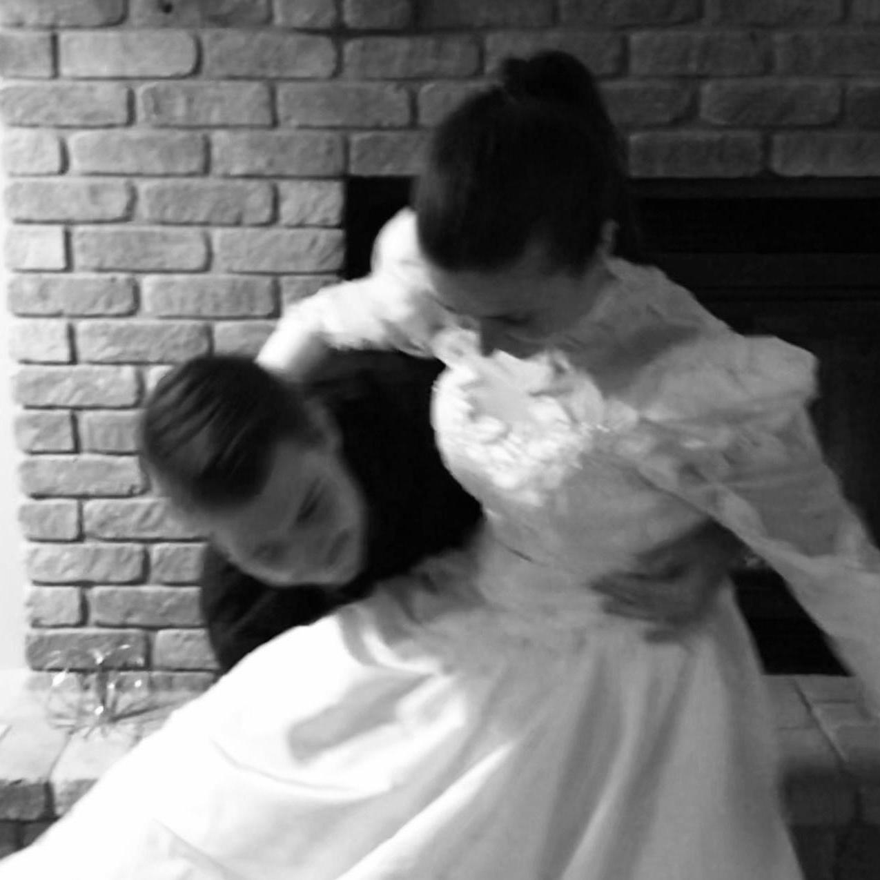 Erin trying on her Mom's wedding dress