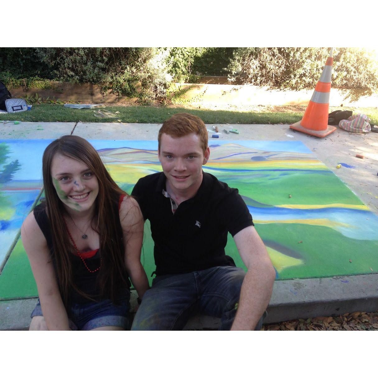 Making a chalk mural square under Erin's art leadership