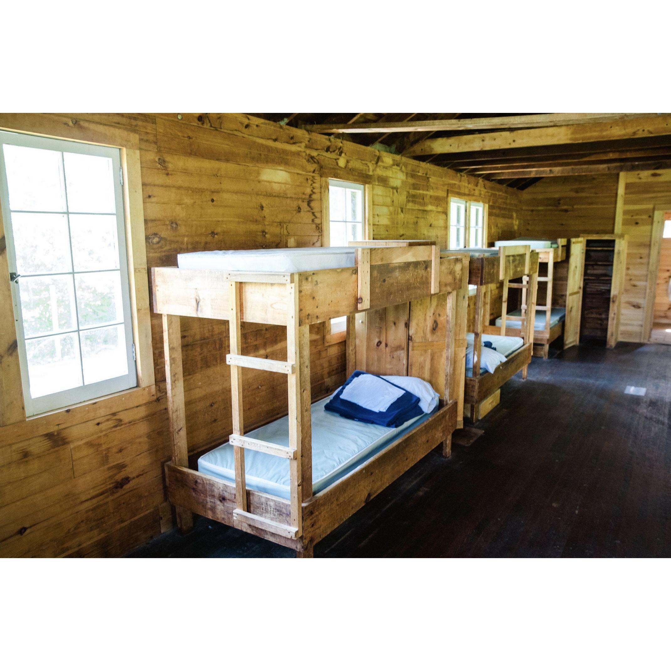 The beds are clean and comfortable! If you're worried about size, Michael is 6'2 and fits in them just fine. The camp regularly hosts adults for their family camps and weddings.