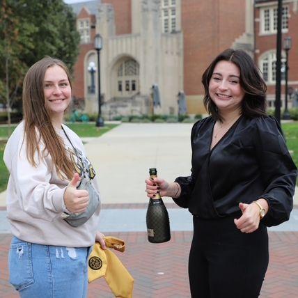 Abby attempting to take aesthetic college graduation pictures with the help of Shy and Photographer Val