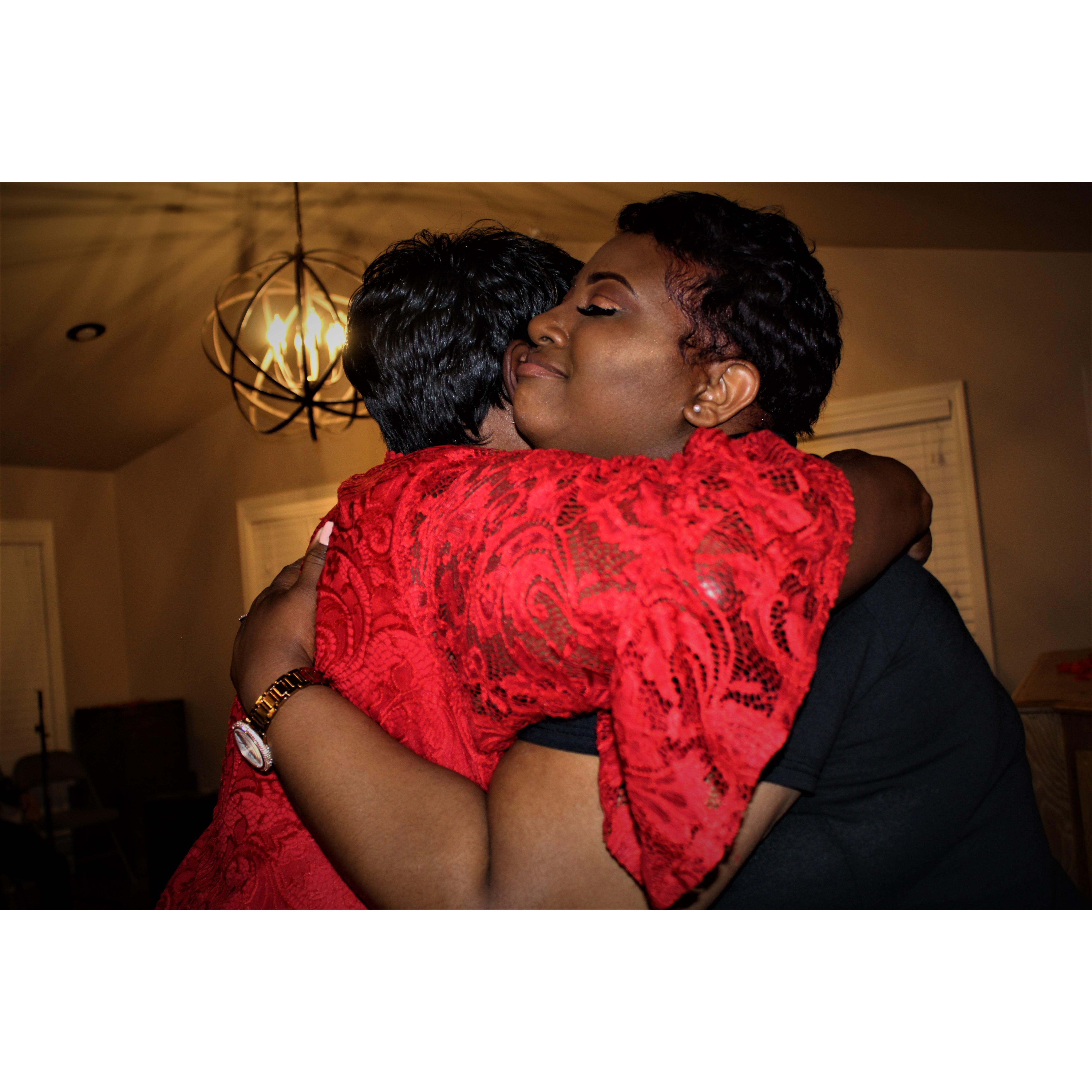 After the two were done taking photos, Napoleon had a change of wardrobe for her. Candace changed and was welcomed by with a warm hug from his mother.