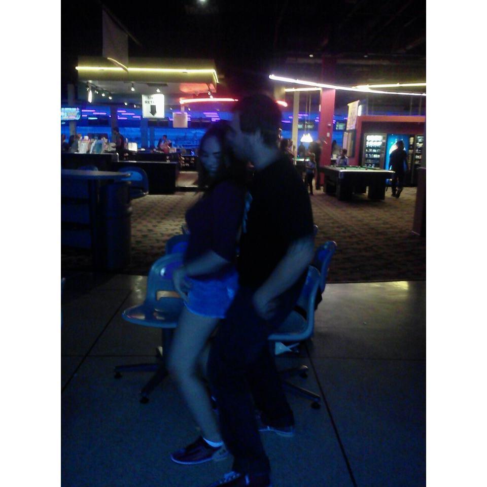 Having fun at a bowling alley on one of our first dates