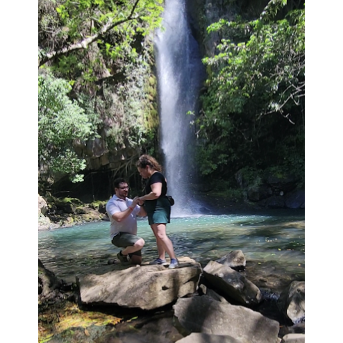 Lance proposed at the bottom of La Cangreja waterfall in Rincon de la Vieja National Park in Costa Rica while on the Looby family vacation