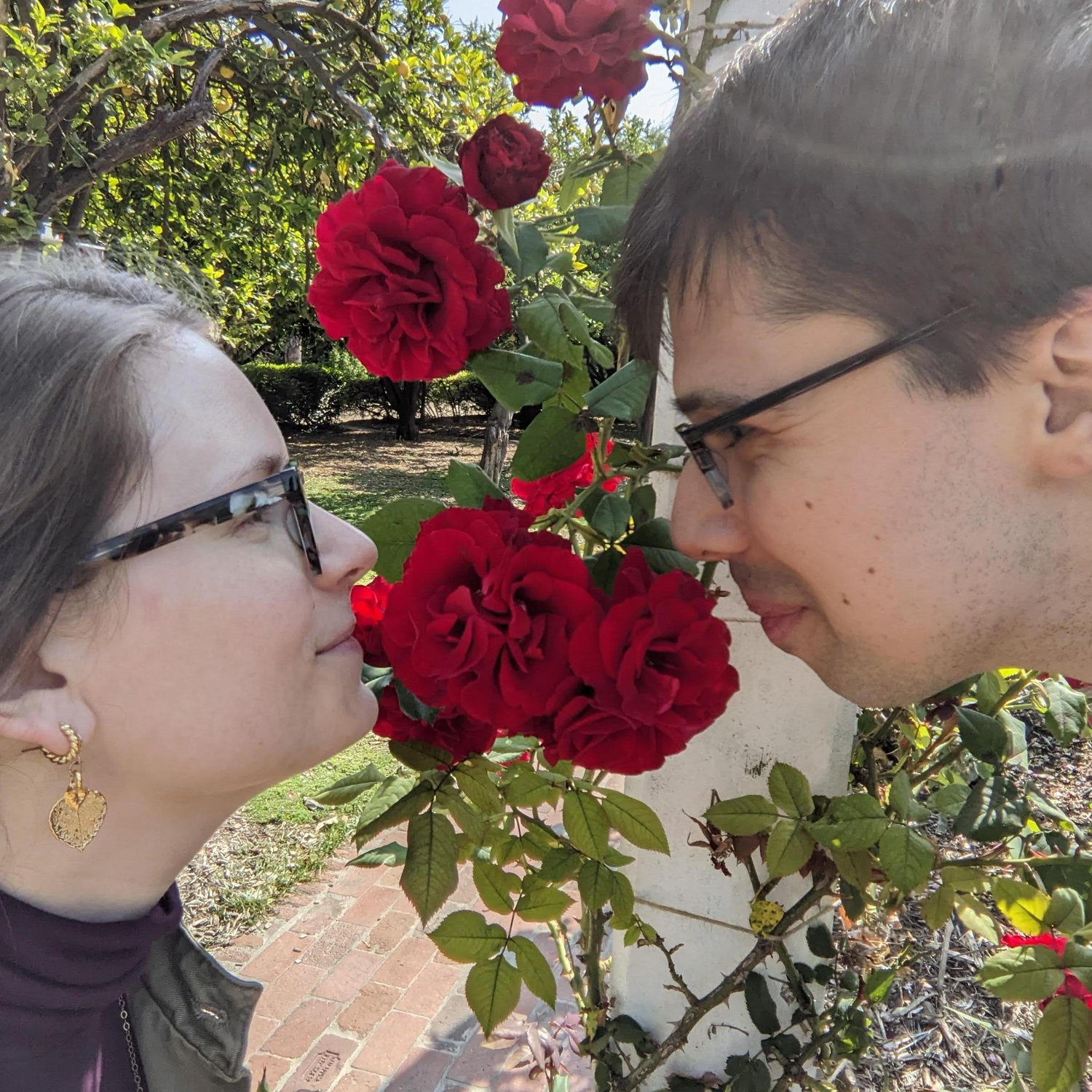 Taking time to smell the roses at Los Angeles County Arboretum, May 2024.