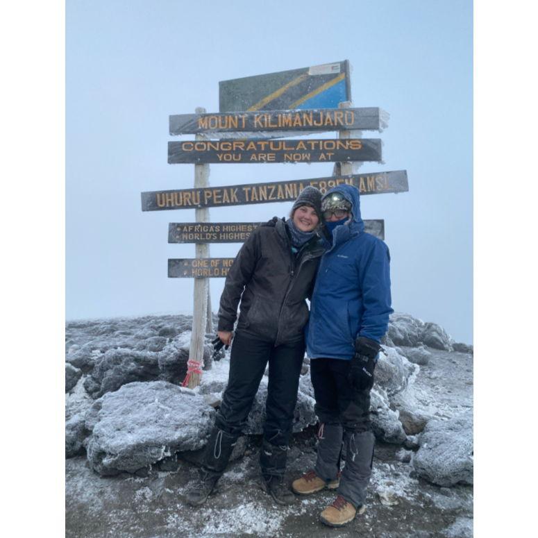 At the summit of Mt. Kilimanjaro in Tanzania after five days of uphill hiking.