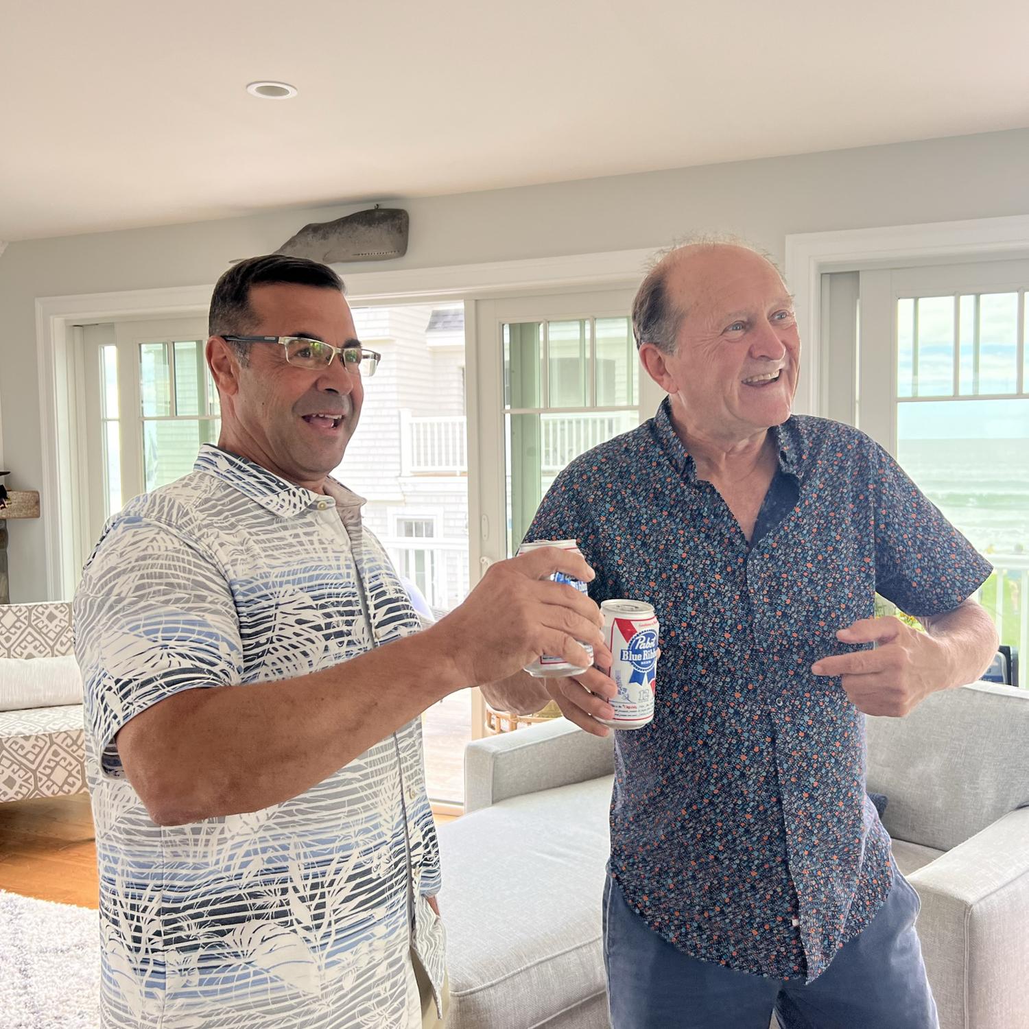 Father of the groom and Father of the bride cheers-ing to the newly engaged couple at Moody Beach, Maine.