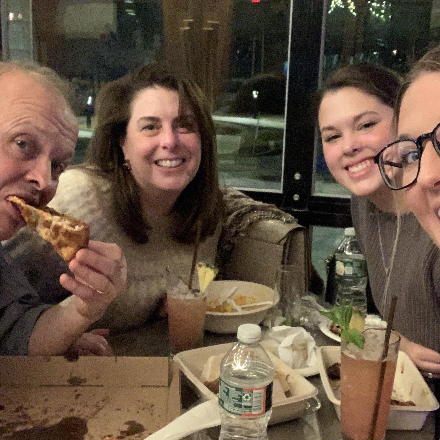 The Baloy clan doing what they do best... eating pizza!