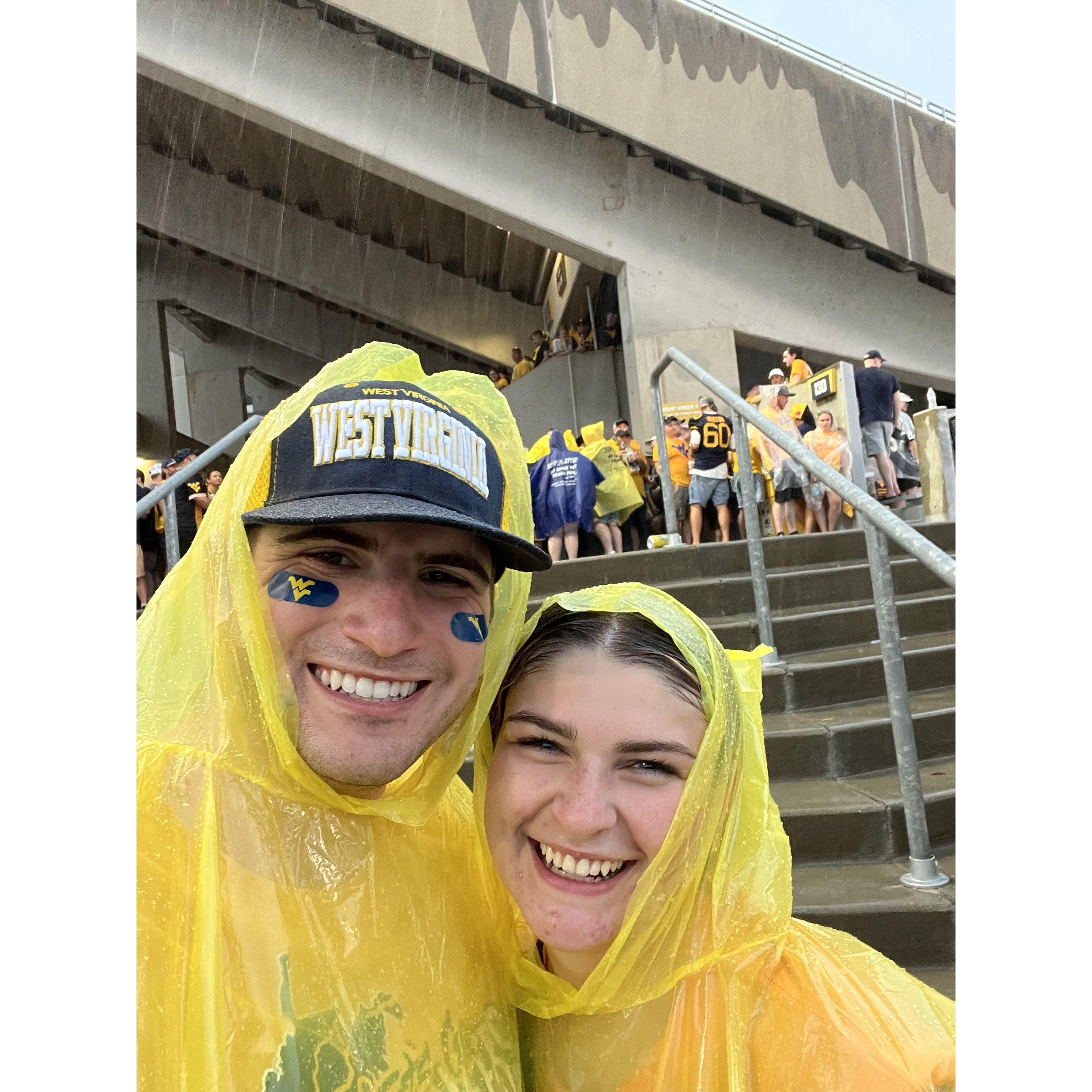 walked home in a thunderstorm at a West Virginia football game and still smiled through it all
