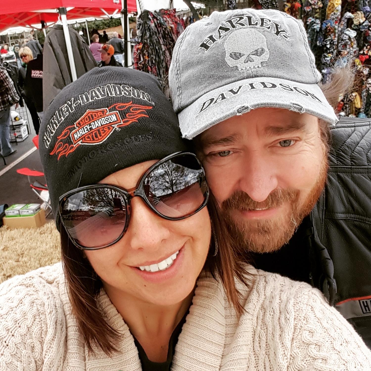 Brett introduced Claire to the motorcycle world. He loves riding his Harley and Claire got her motorcycle license as well. This picture was taken at their 1st Harley Davidson event!