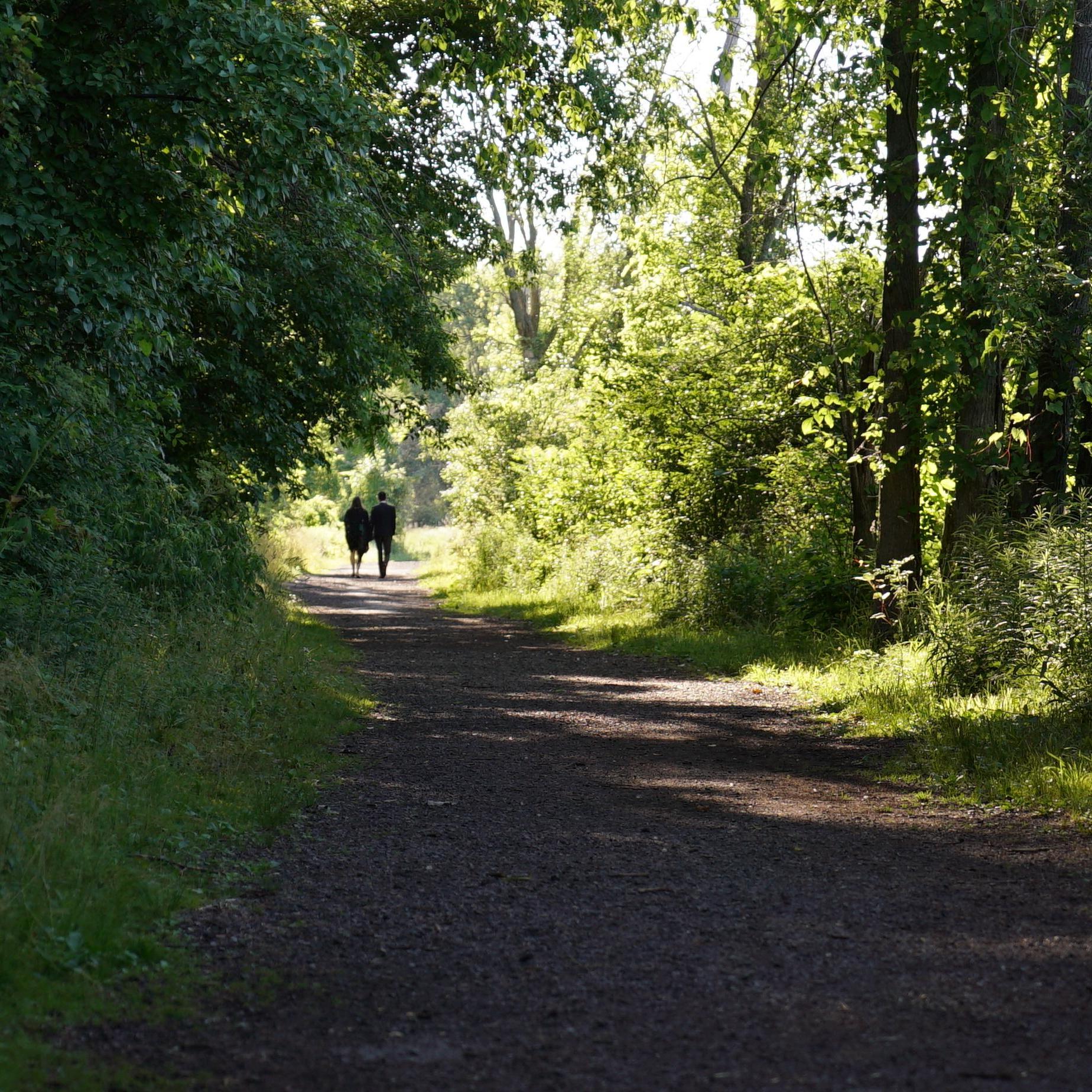 Our photographer, my best man Michael Consiglio, follows us secretly from a distance as I take Faith on a walk through Buckhorn to a special spot on the water.