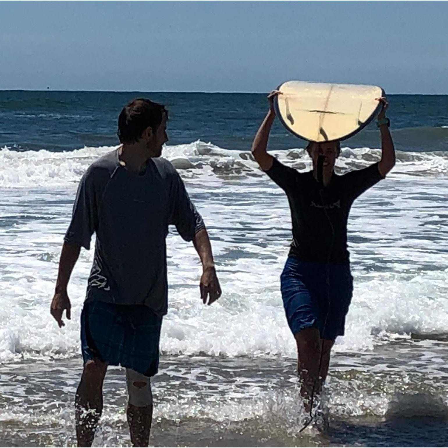 Evan teaching Emily how to surf in Margate City, NJ