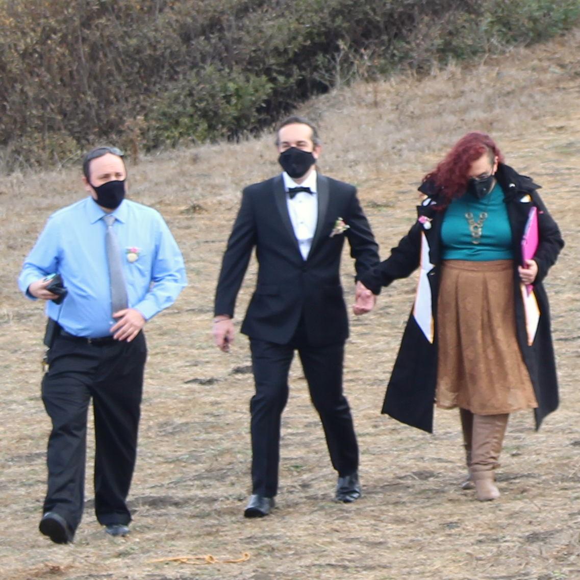 Angelo arriving with the help of his best man (brother) and officiant (sister).