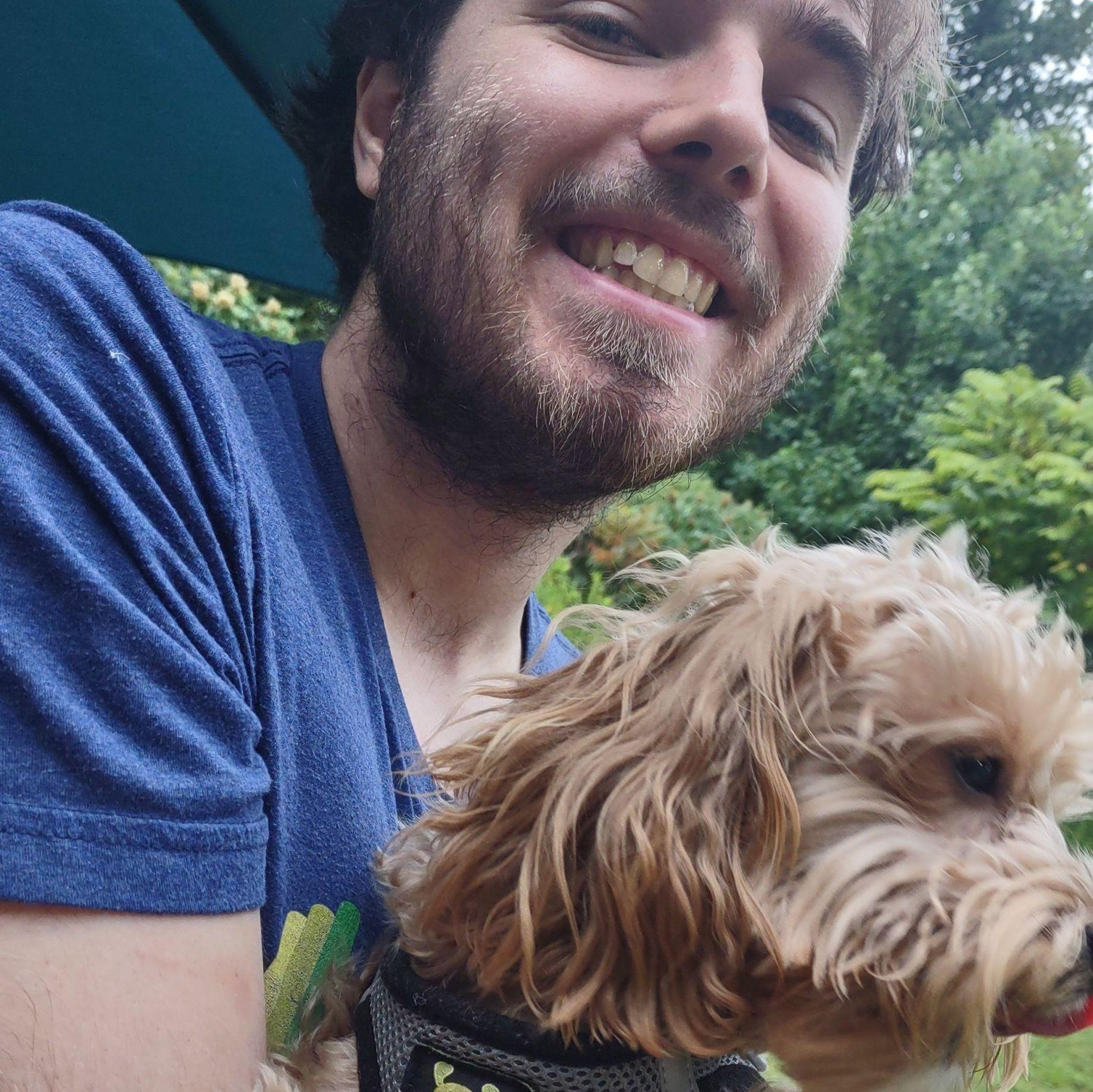 Jake holding my nephew's dog, Pixie