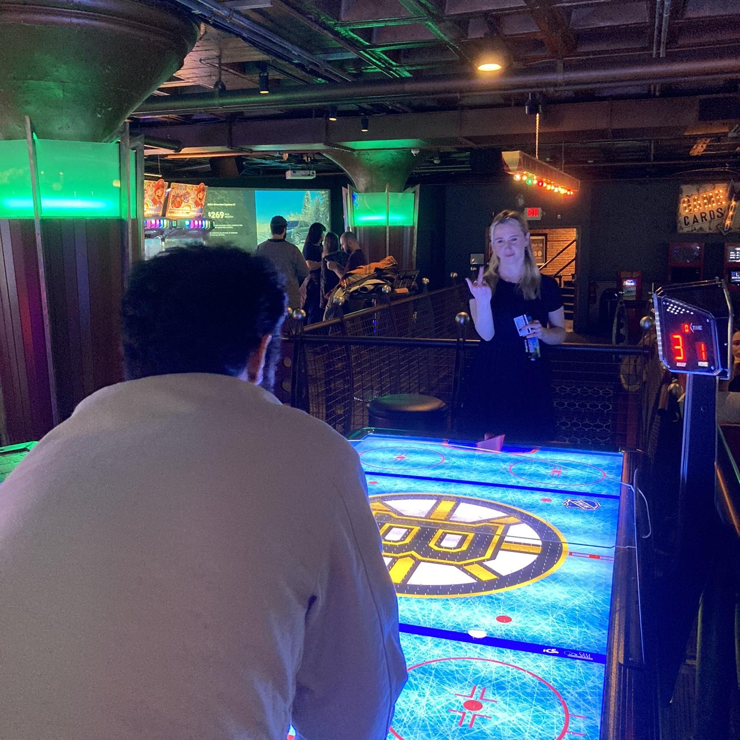 Emily Losing Air Hockey, Winter 2024