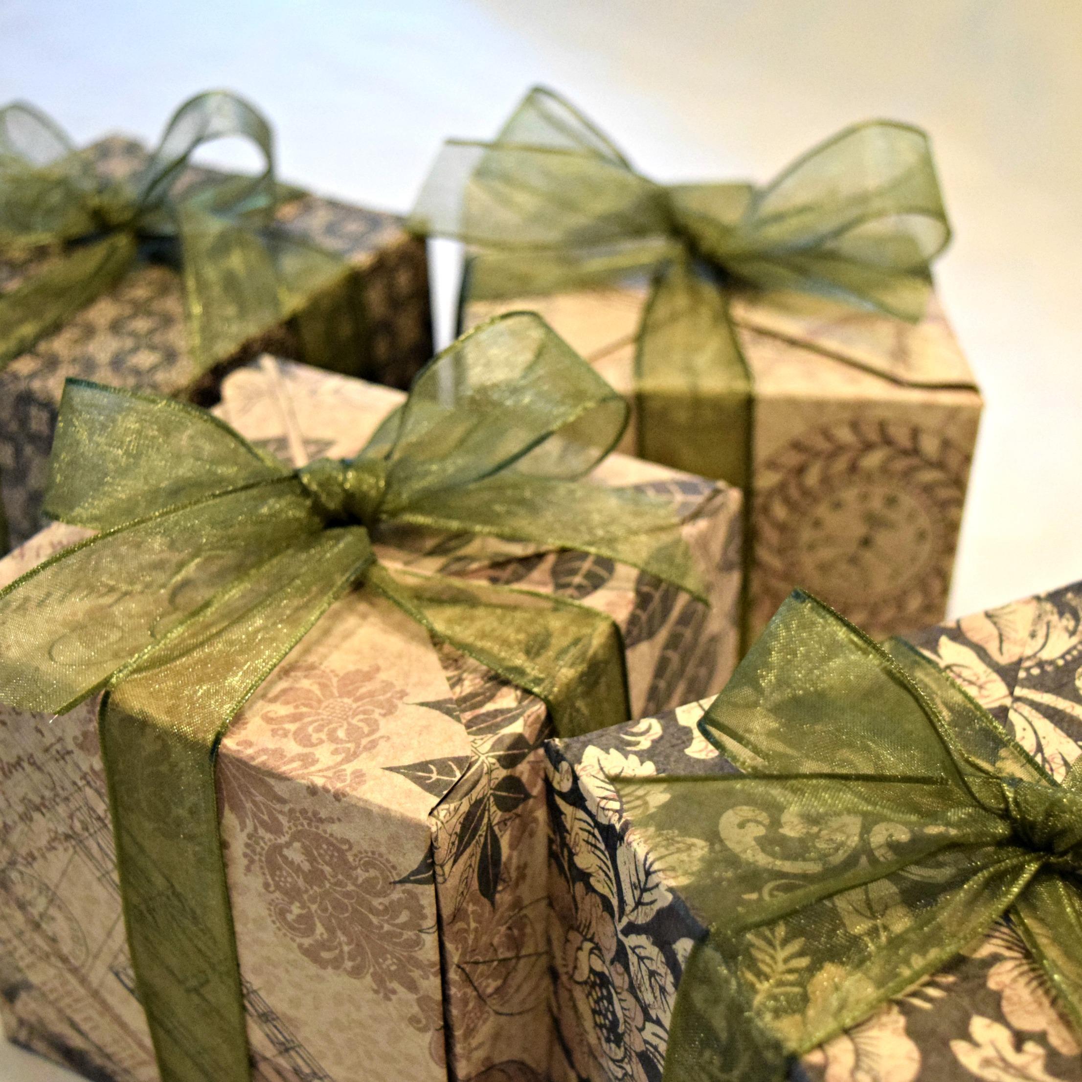 They were wrapped up in handmade boxes made by Emily. A beautiful ribbon was wrapped around the boxes and tied into a bow.