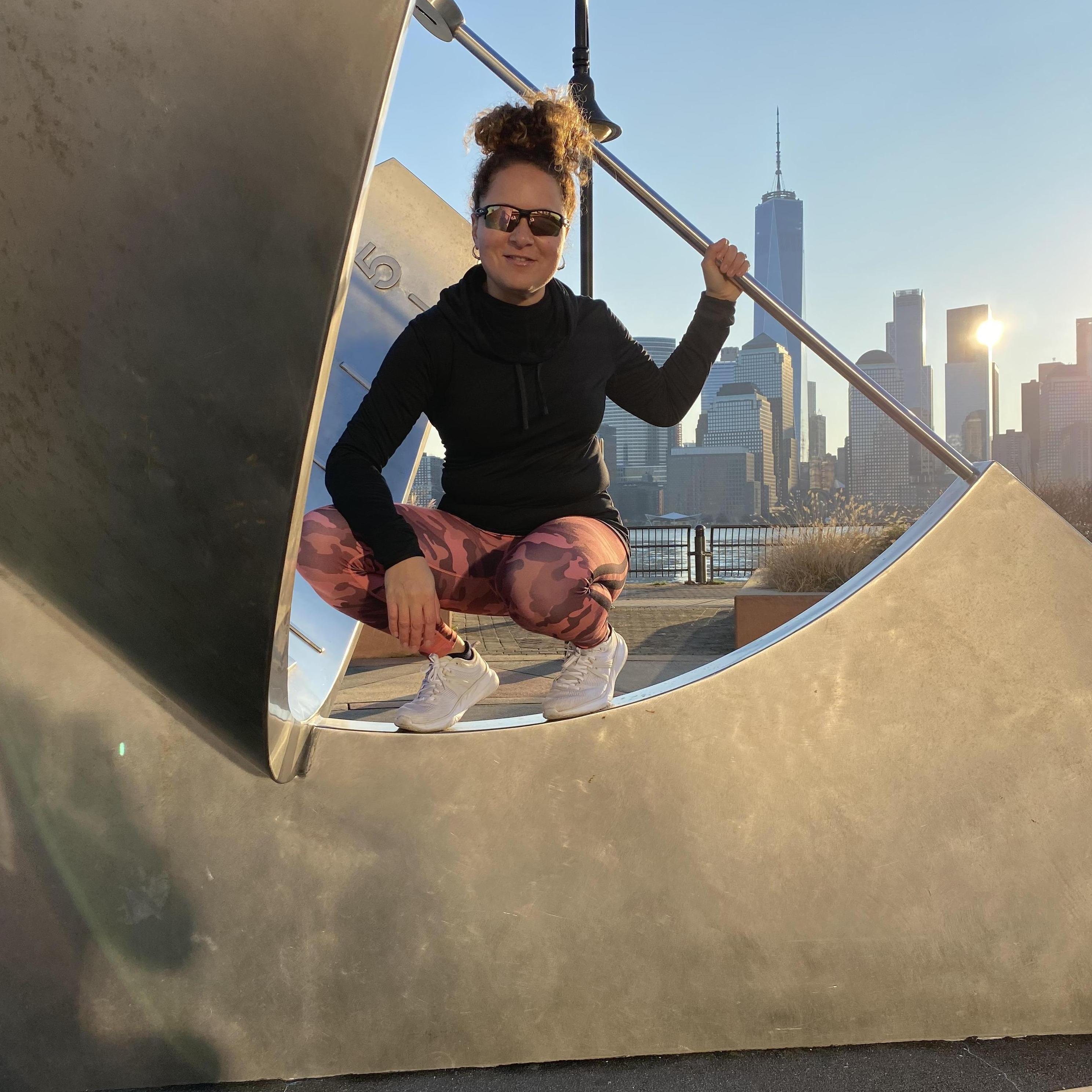 Queen of the sundial in the big city.  She's feeling at home with NYC in the background; but for the record, her feet are firmly planted on the Jersey side.