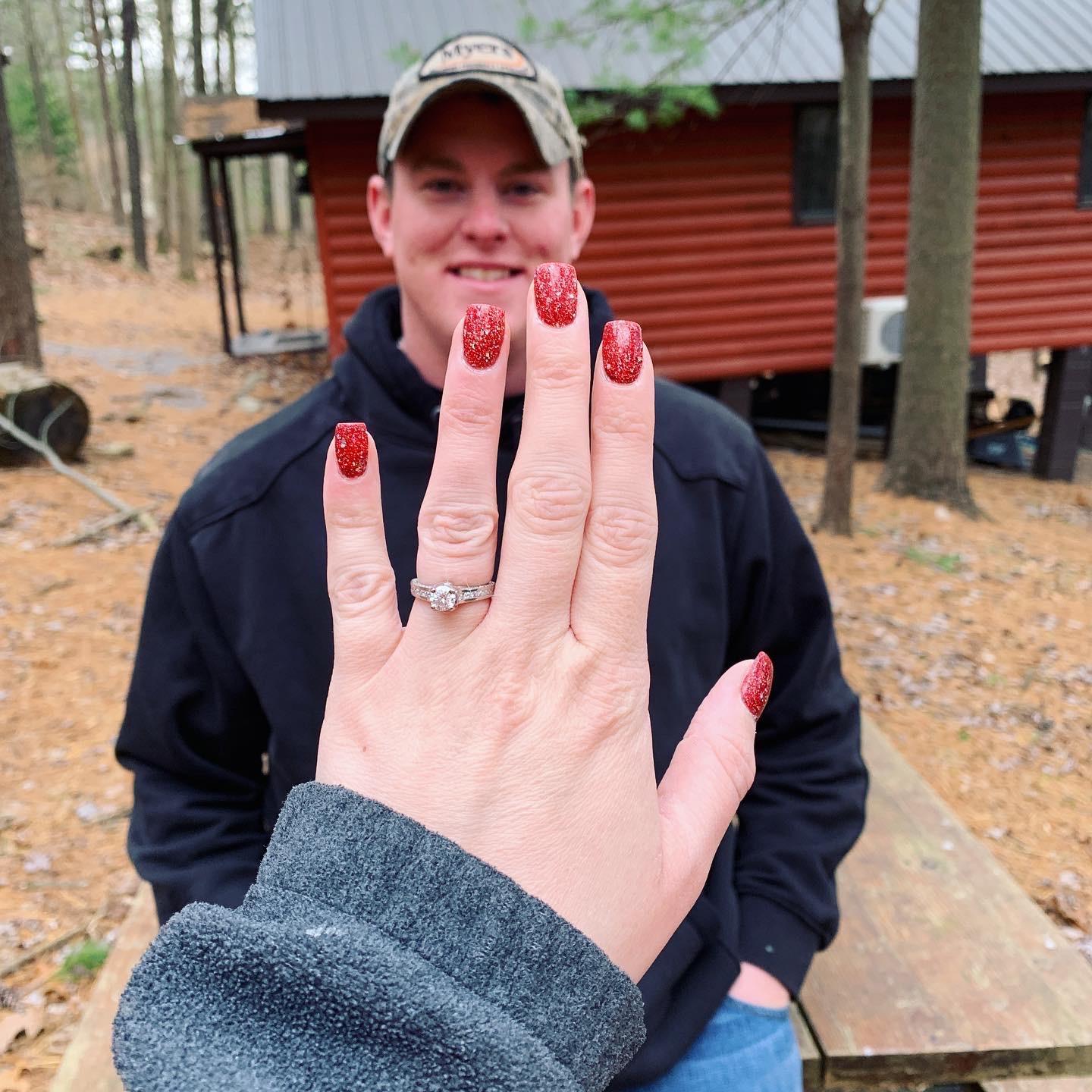 Showing off the ring the day after we got engaged.