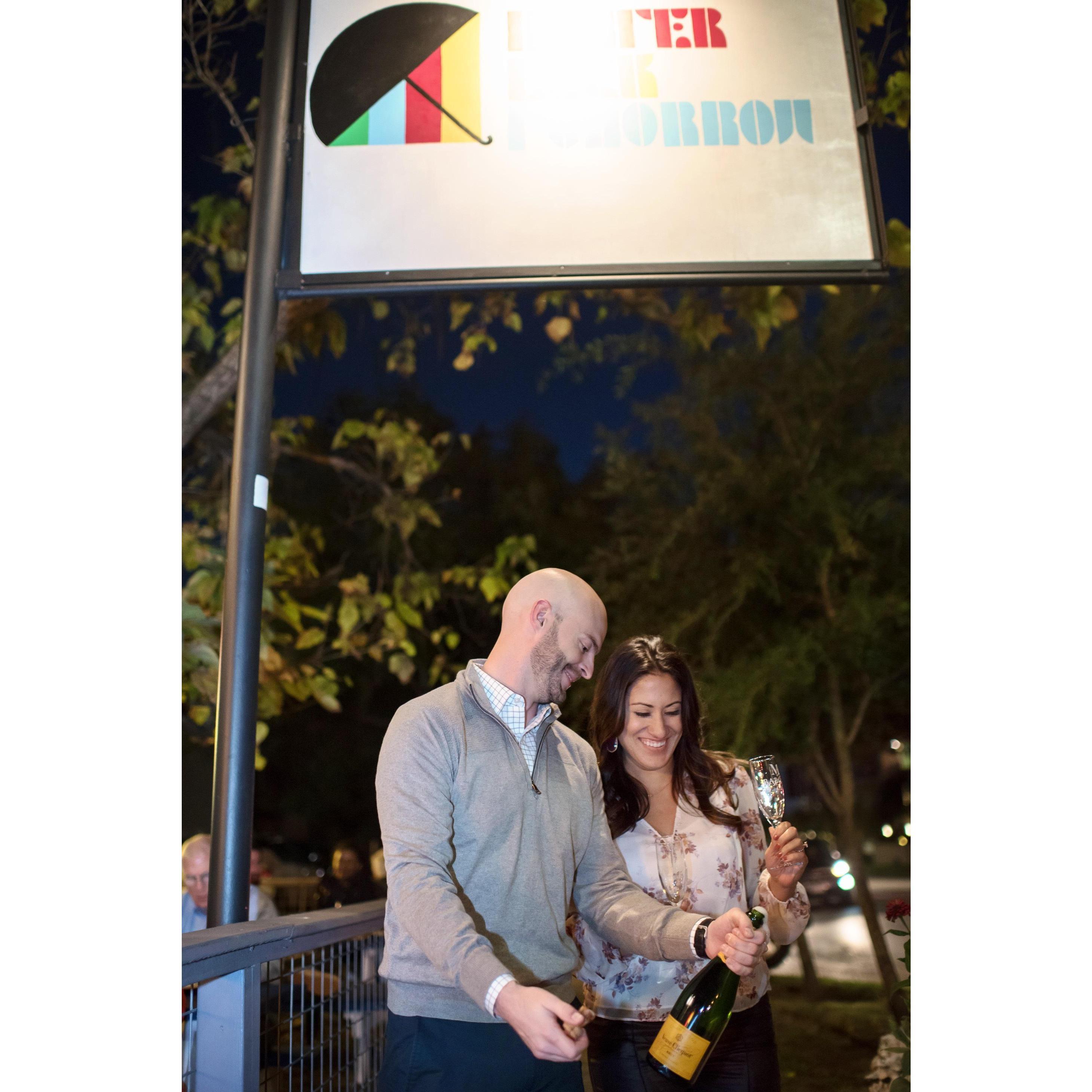 Engagement photo session. Popping champagne where we first met.