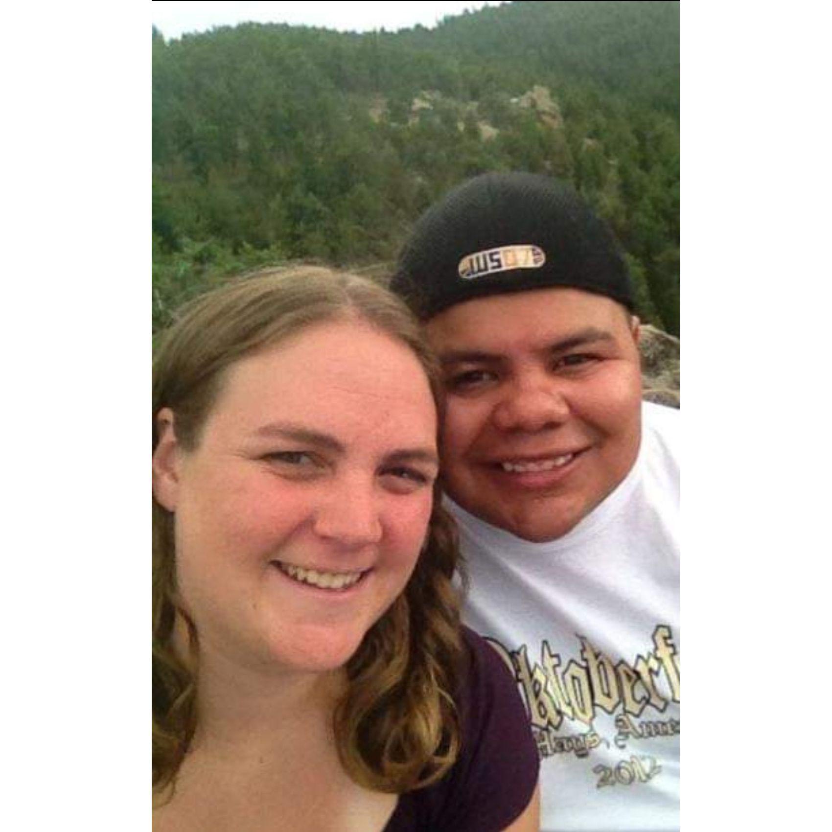 Hays Oktoberfest shirt so we know it’s real. Picture taken on the same mountain we are about to get married on.