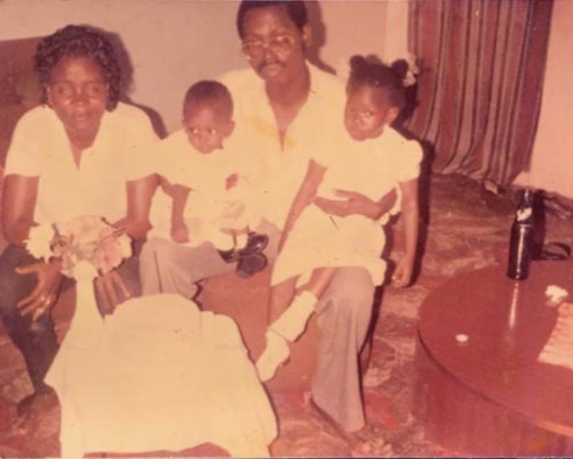 Enny with mom and dad and a family friend's daughter, when Enny was one