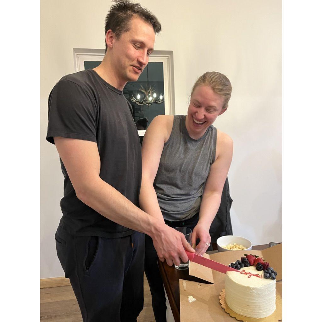 Cutting the cake after our engagement! We were on a ski trip in Aspen with friends and they all made this night feel so special and loving!