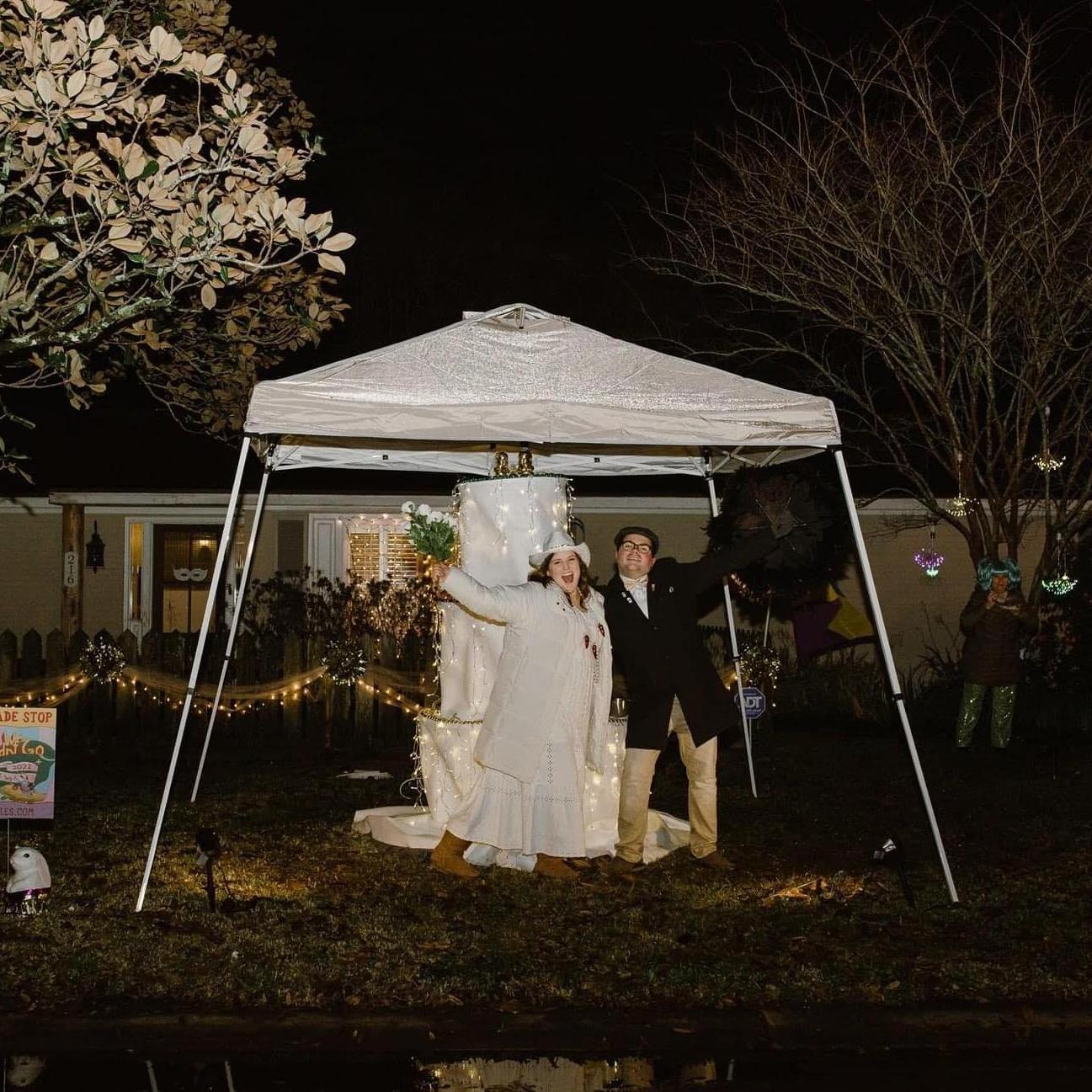 In front of our "Wedding That Wasn't" float for the 2020 Mardi Gras walking parade.