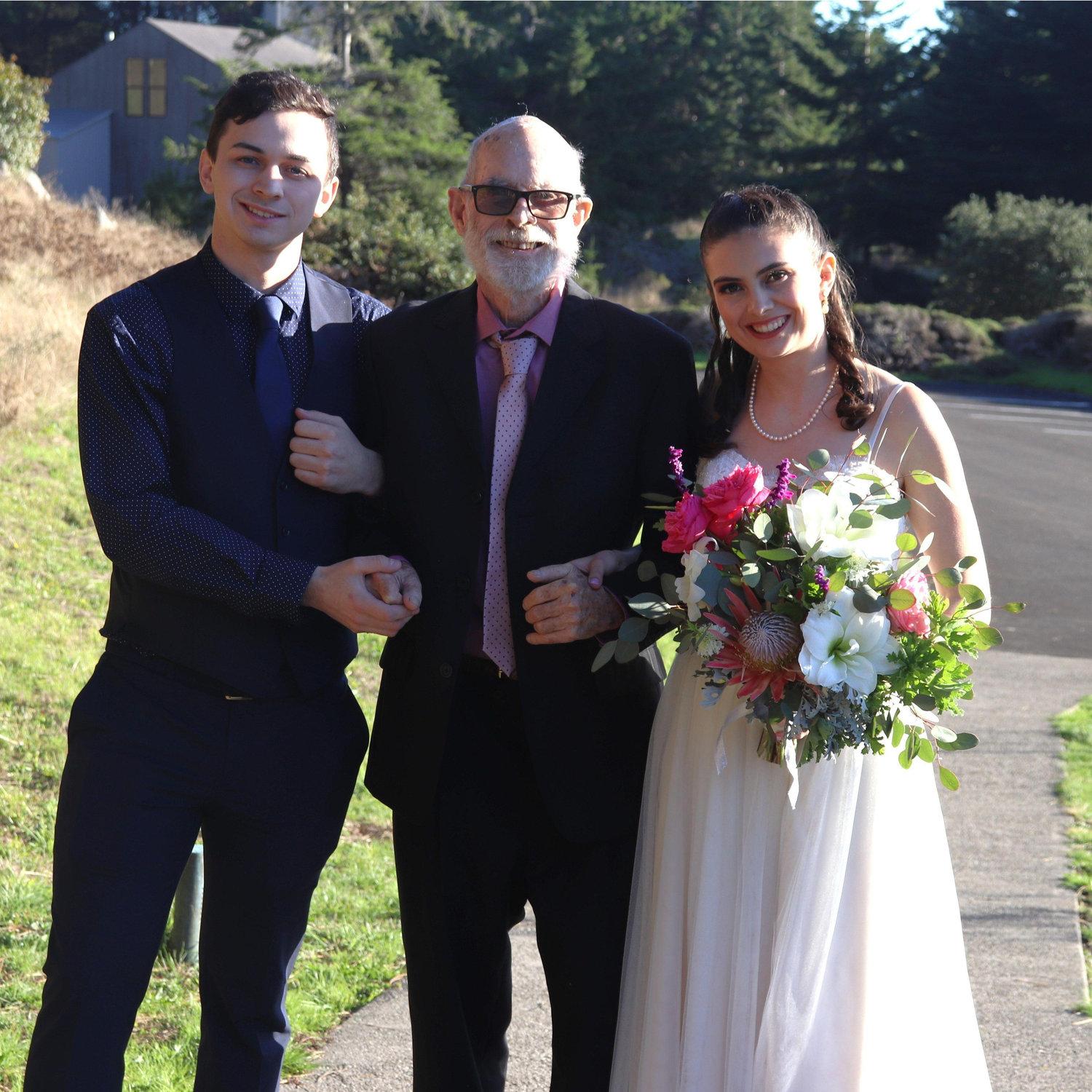 Joey, Dennis, and Shannon walking down the aisle.