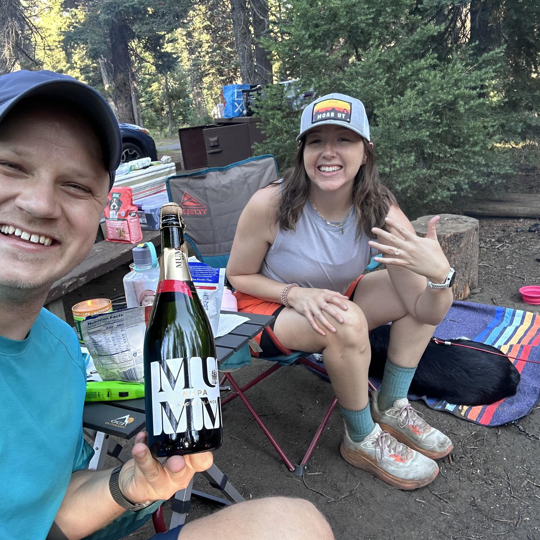 Celebrating our engagement with champagne and freeze dried camp meals!!