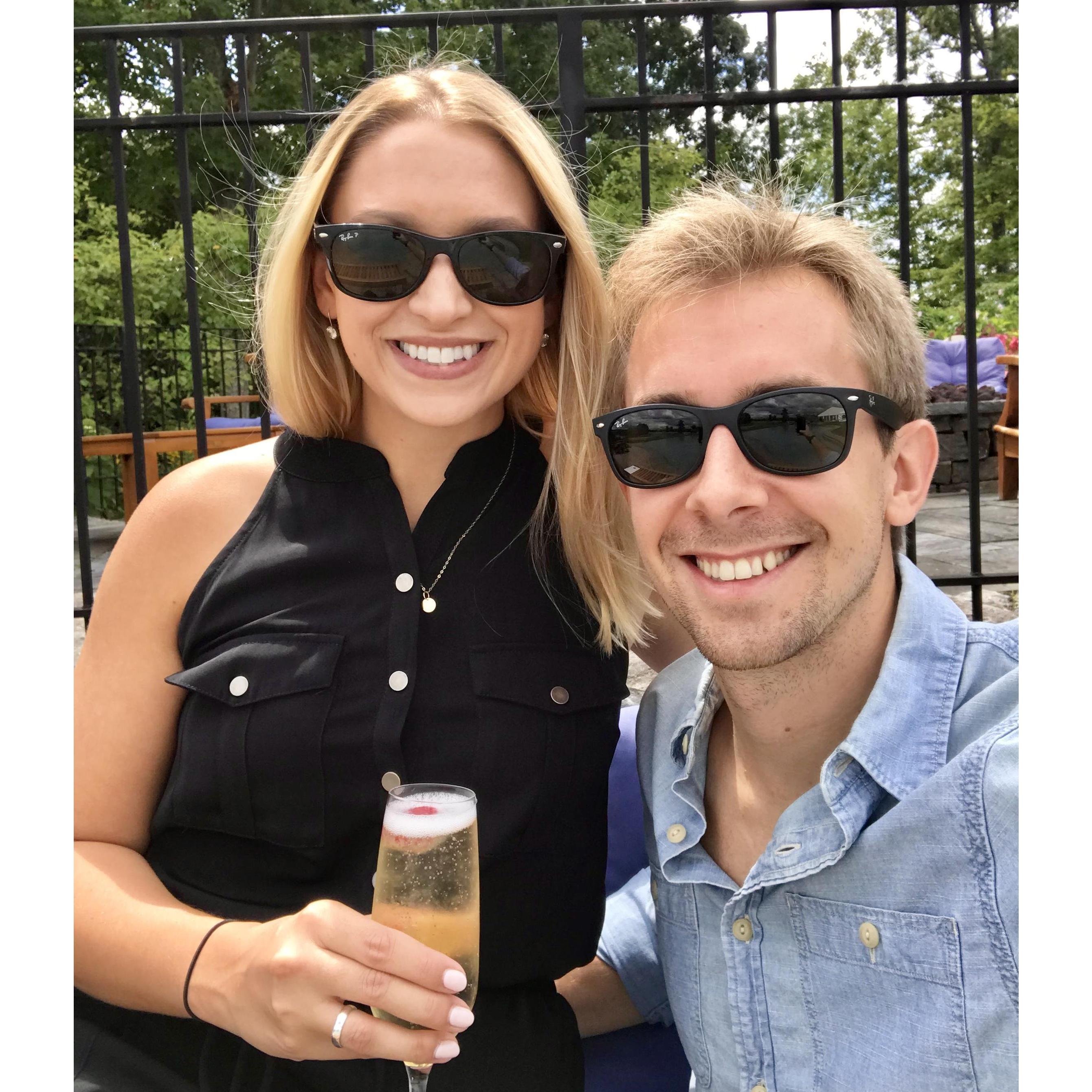 Sipping champagne after booking our wedding venue!