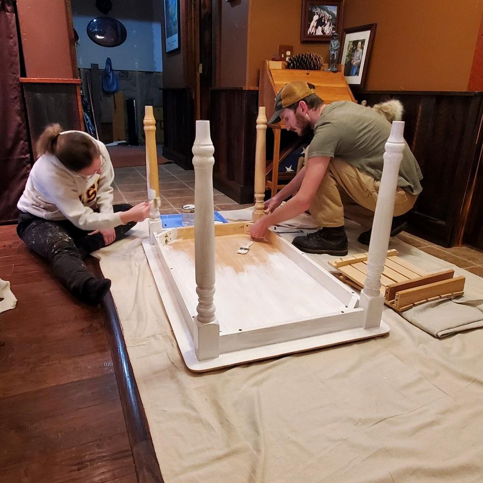 Us fixing up an old table and chairs to put in our house. April 2023