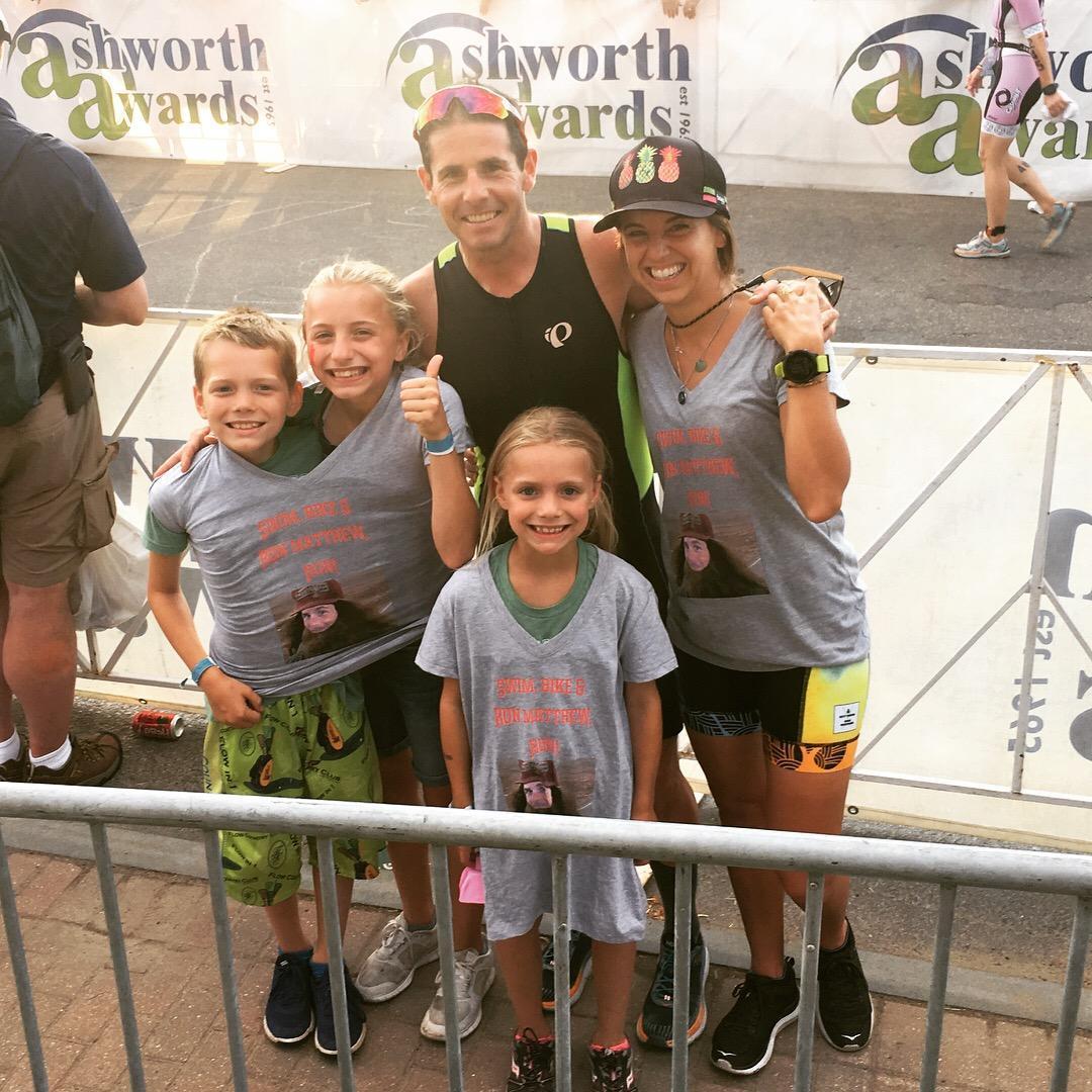 Matthew in Lake Placid in 2018 with kiddos of his long time friends. right after he finished Ironman #5!